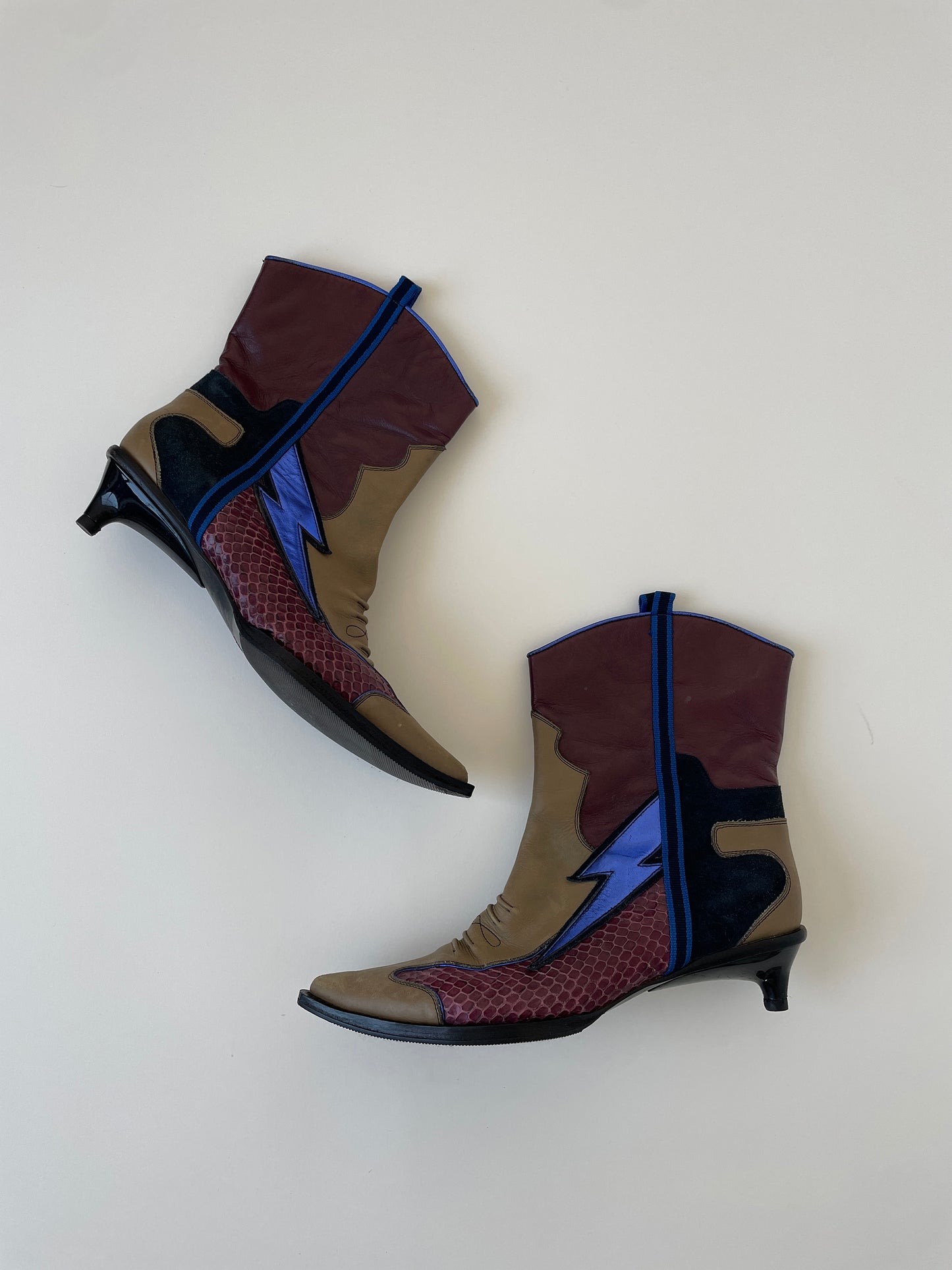 Vintage Miu Miu 1990s are python flash metallic kitten heel western boots.