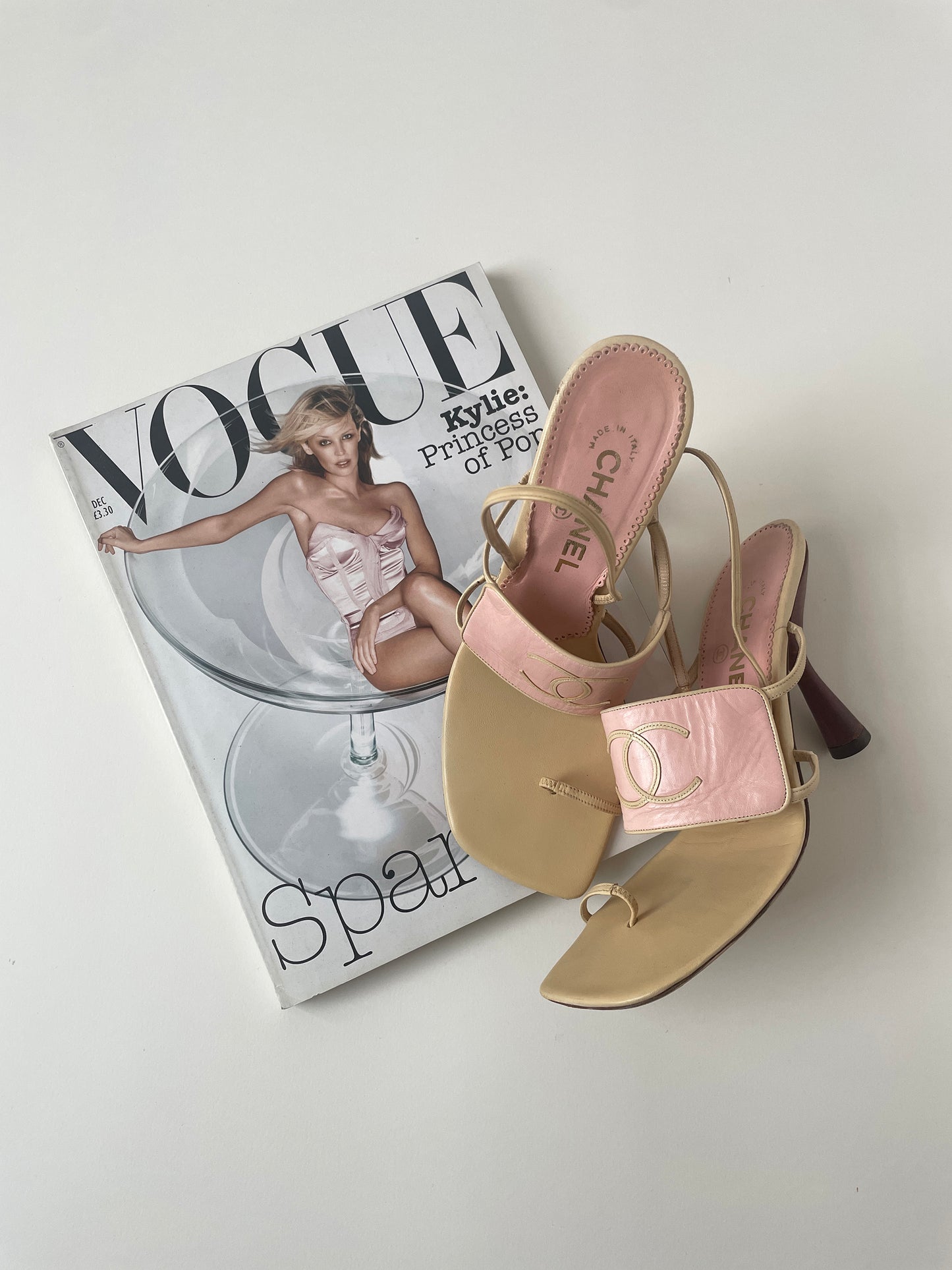 Vintage Chanel iconic 1990s by Karl Lagerfeld CC logo light pink flip flop heels with toe strap and flared heel.