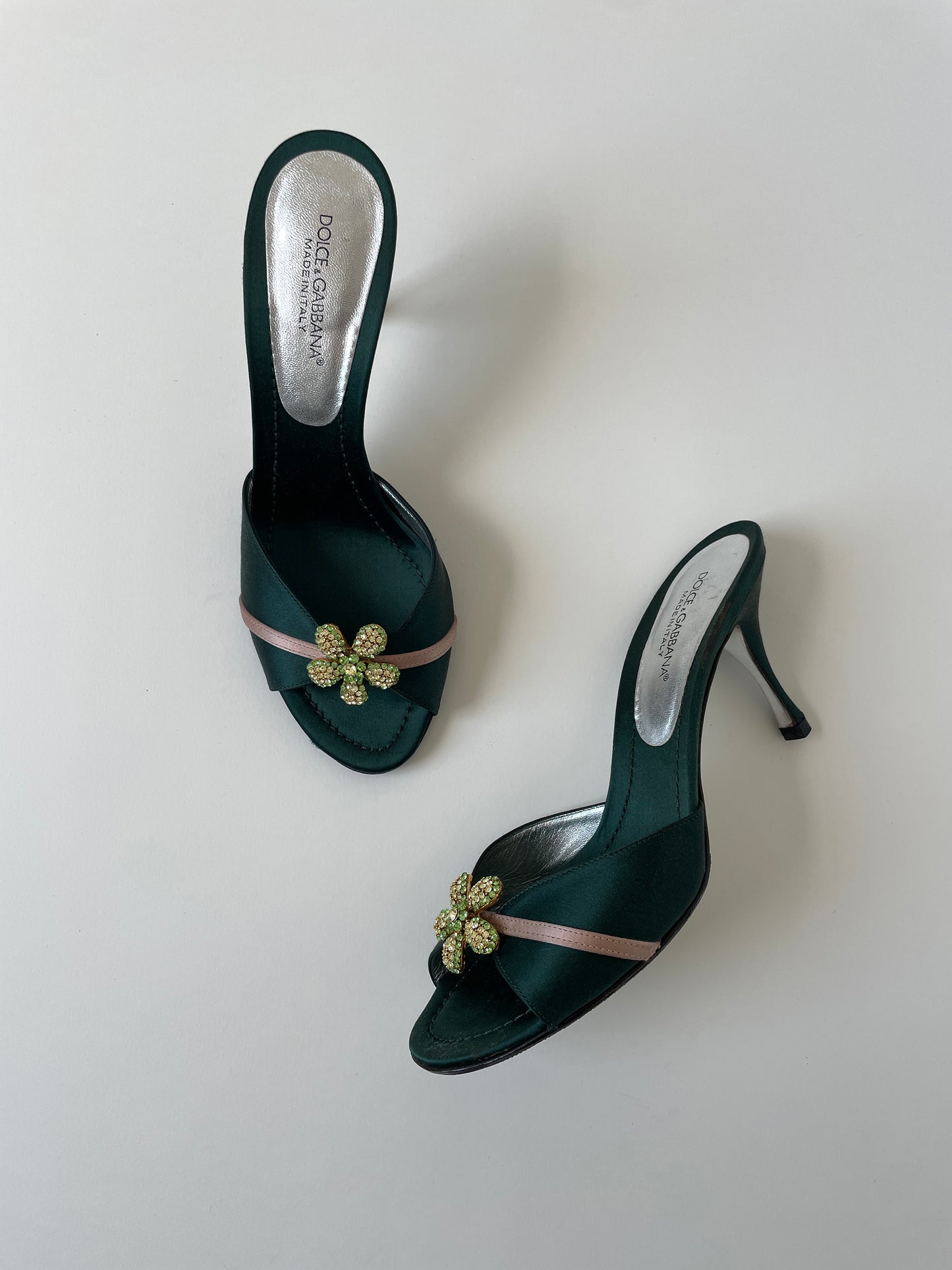 Vintage Dolce & Gabbana 2000s emerald satin heels with green rhinestone flower application.