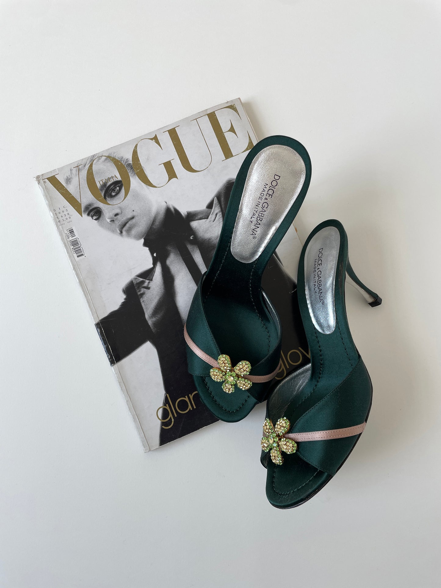 Vintage Dolce & Gabbana 2000s emerald satin heels with green rhinestone flower application.
