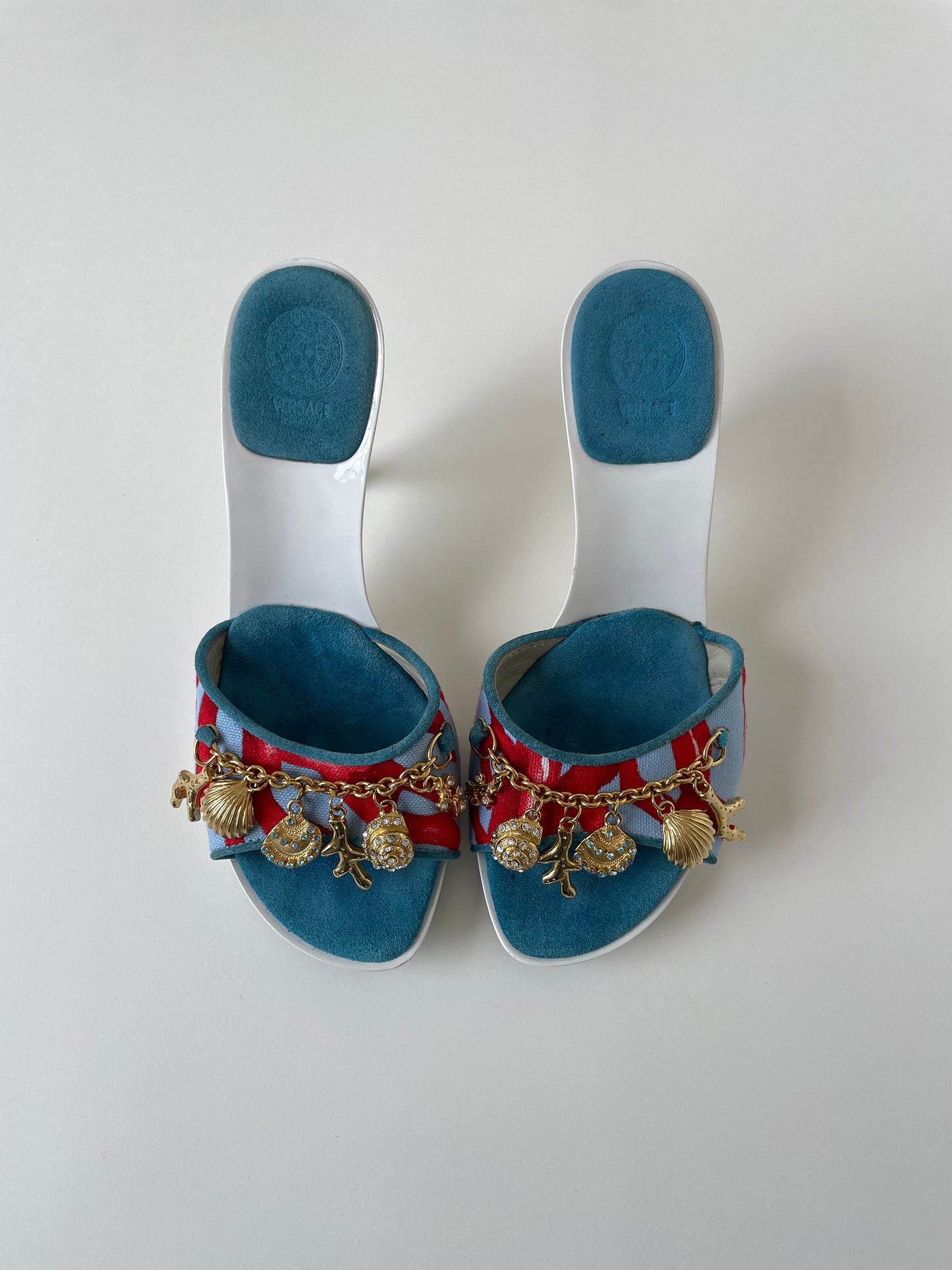 Vintage Gianni Versace 2000s white platform heels with golden sea shells and coral charms.