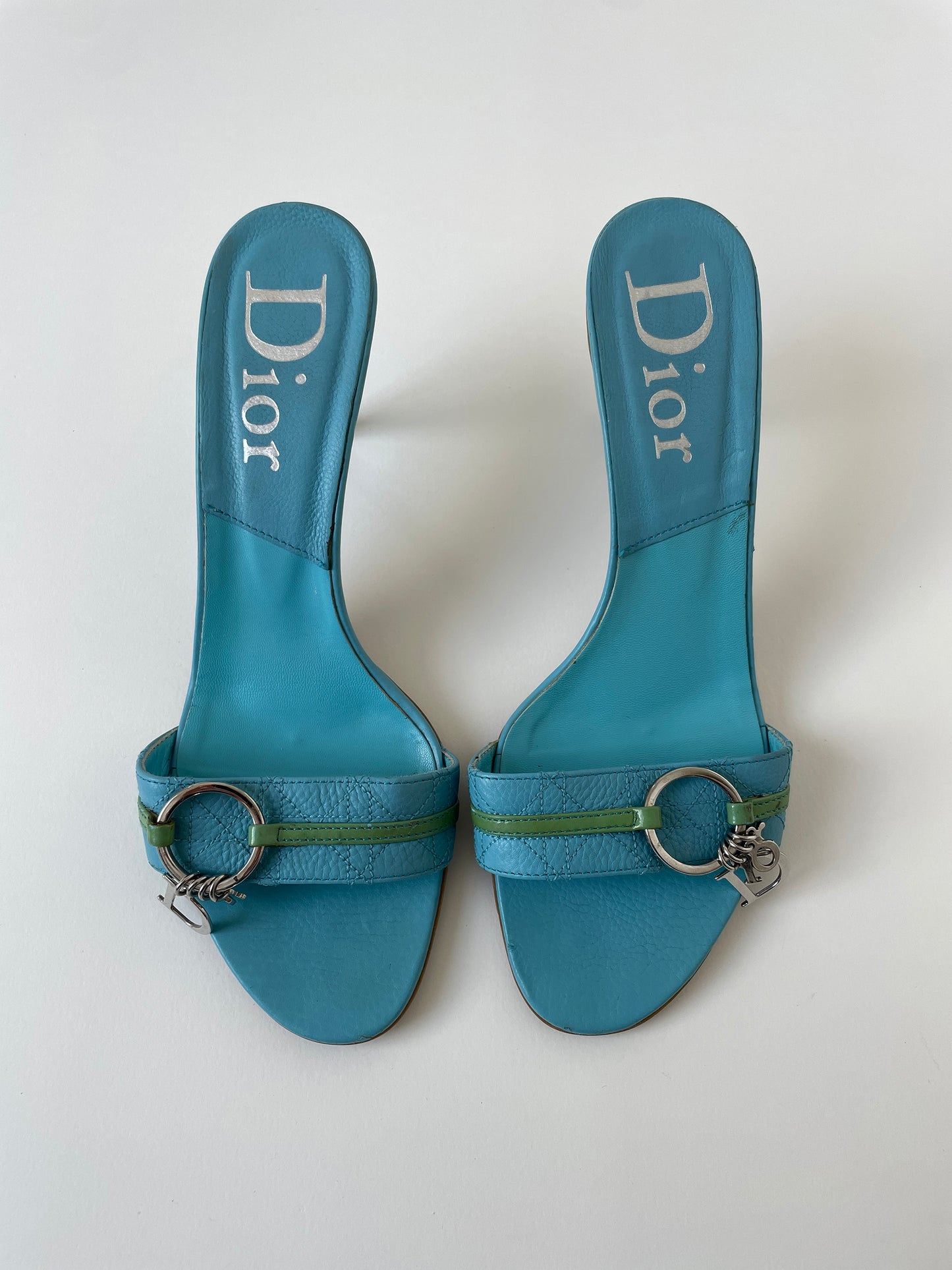 Vintage Christian Dior by John Galliano 2000s off turquoise charm kitten heel with ring detail.