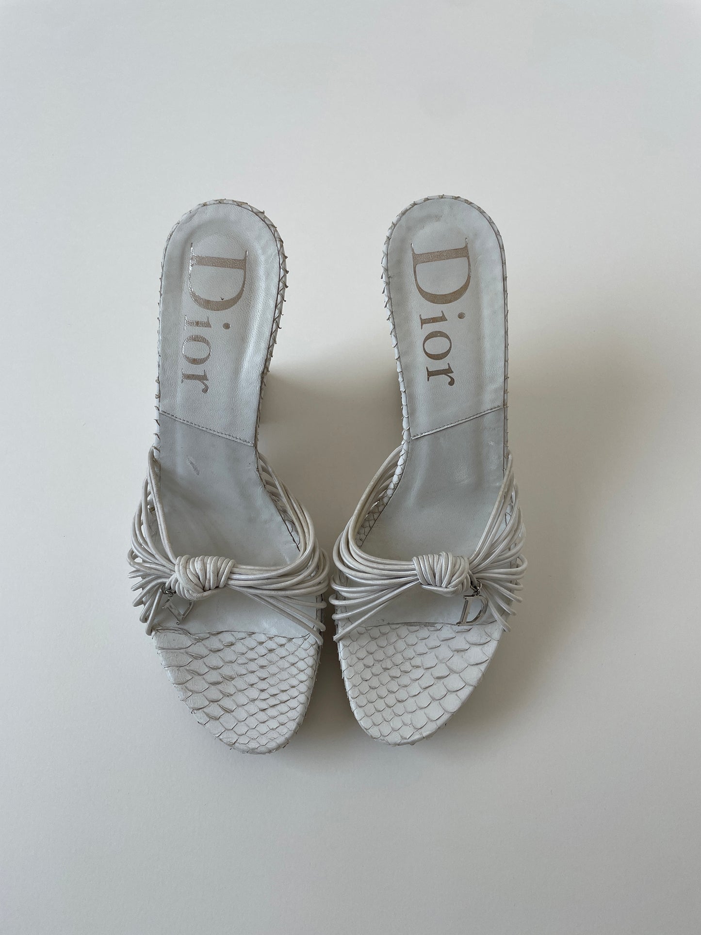 Vintage Christian Dior by John Galliano 2003 white python wedge platform heels with silver D-charms.
