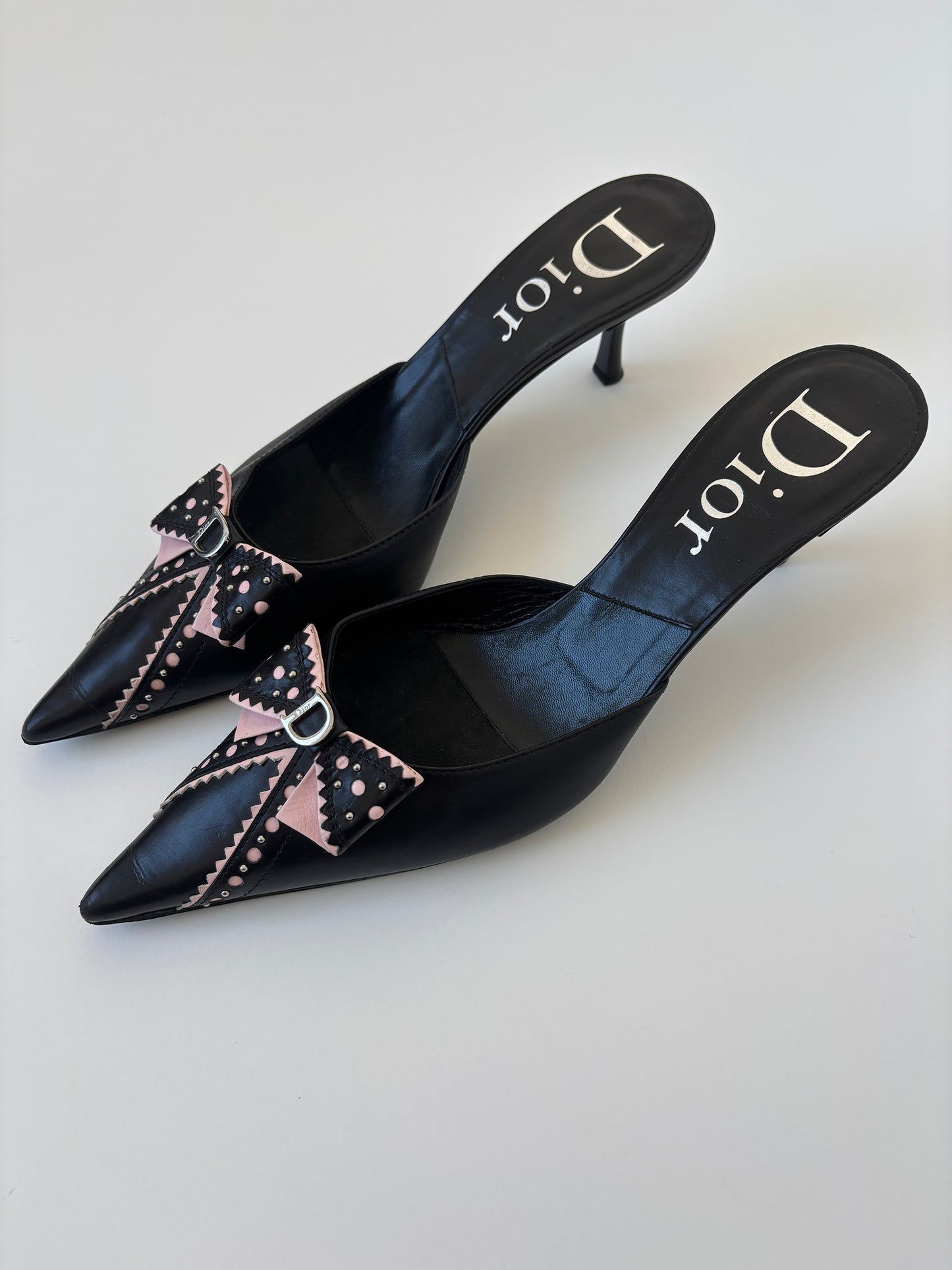 Vintage Christian Dior by John Galliano 2000s black pink D Trick bow kitten heels with cute mini logo and dainty eyelets.
