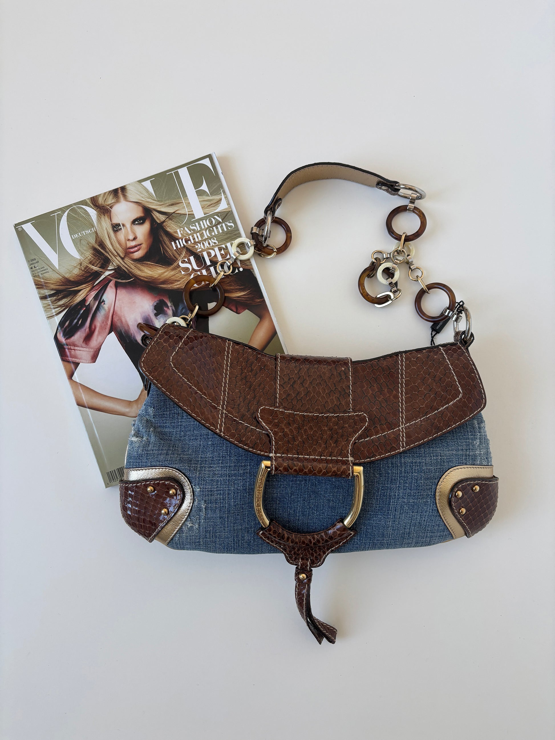 Vintage Dolce & Gabbana O-Ring SS 2005 XL baguette bag python leather and denim with chunky ring details. Iconic cheetah print lining.