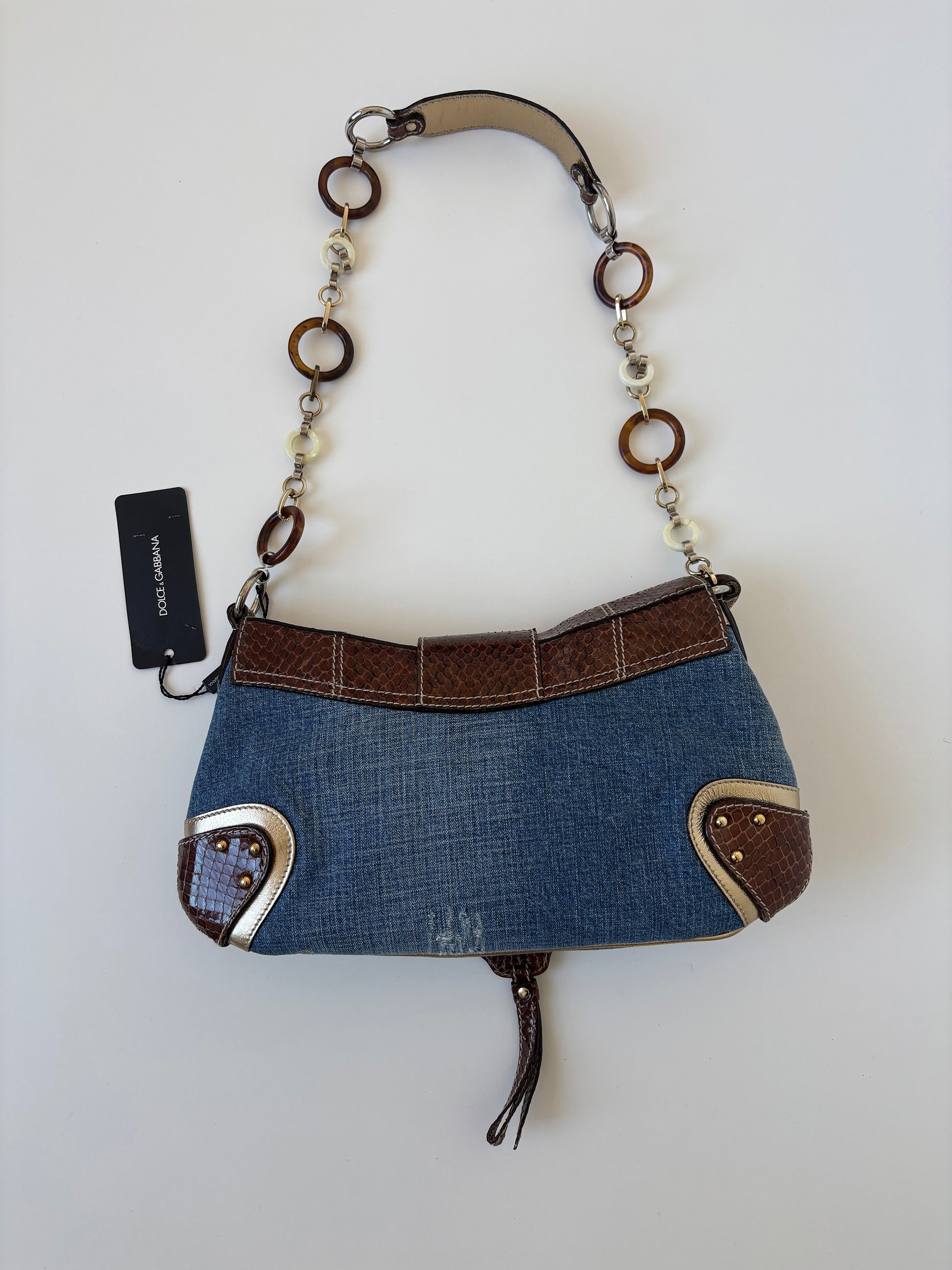 Vintage Dolce & Gabbana O-Ring SS 2005 XL baguette bag python leather and denim with chunky ring details. Iconic cheetah print lining.