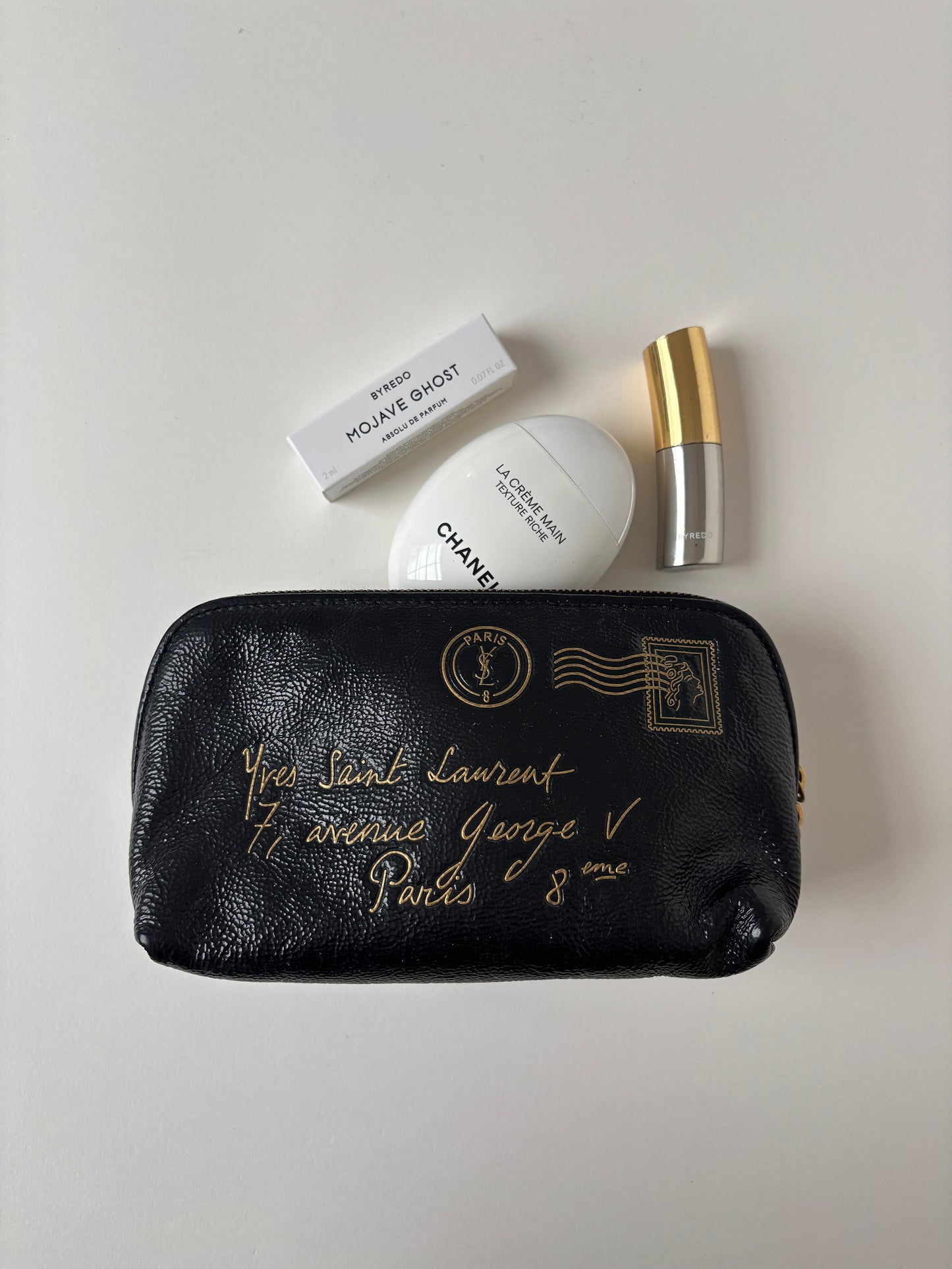 Vintage YSL by Tom Ford 2000s mini pochette with golden postcard print.