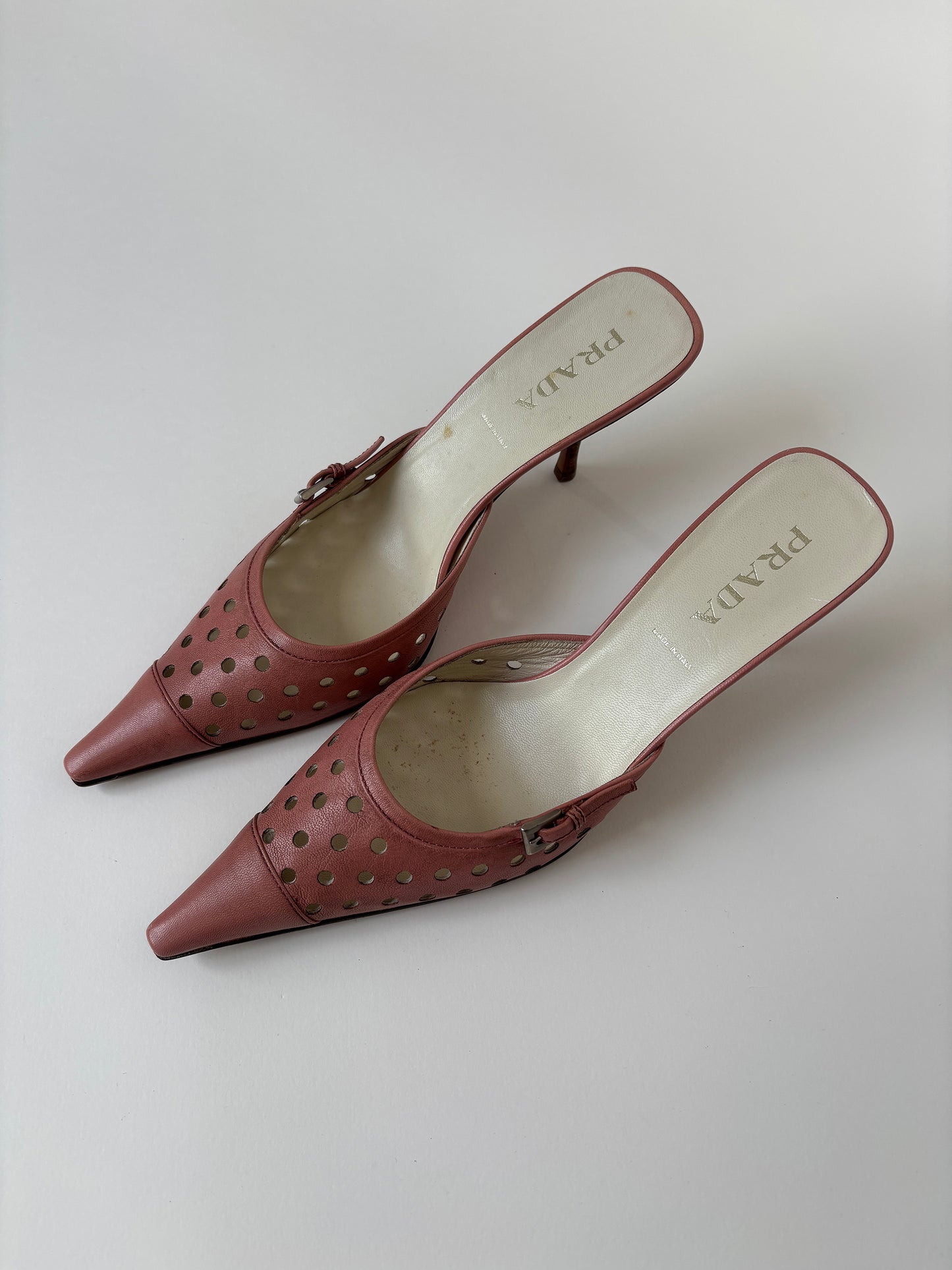 Vintage Prada 2000s pink eyelet mules with cute buckle details.