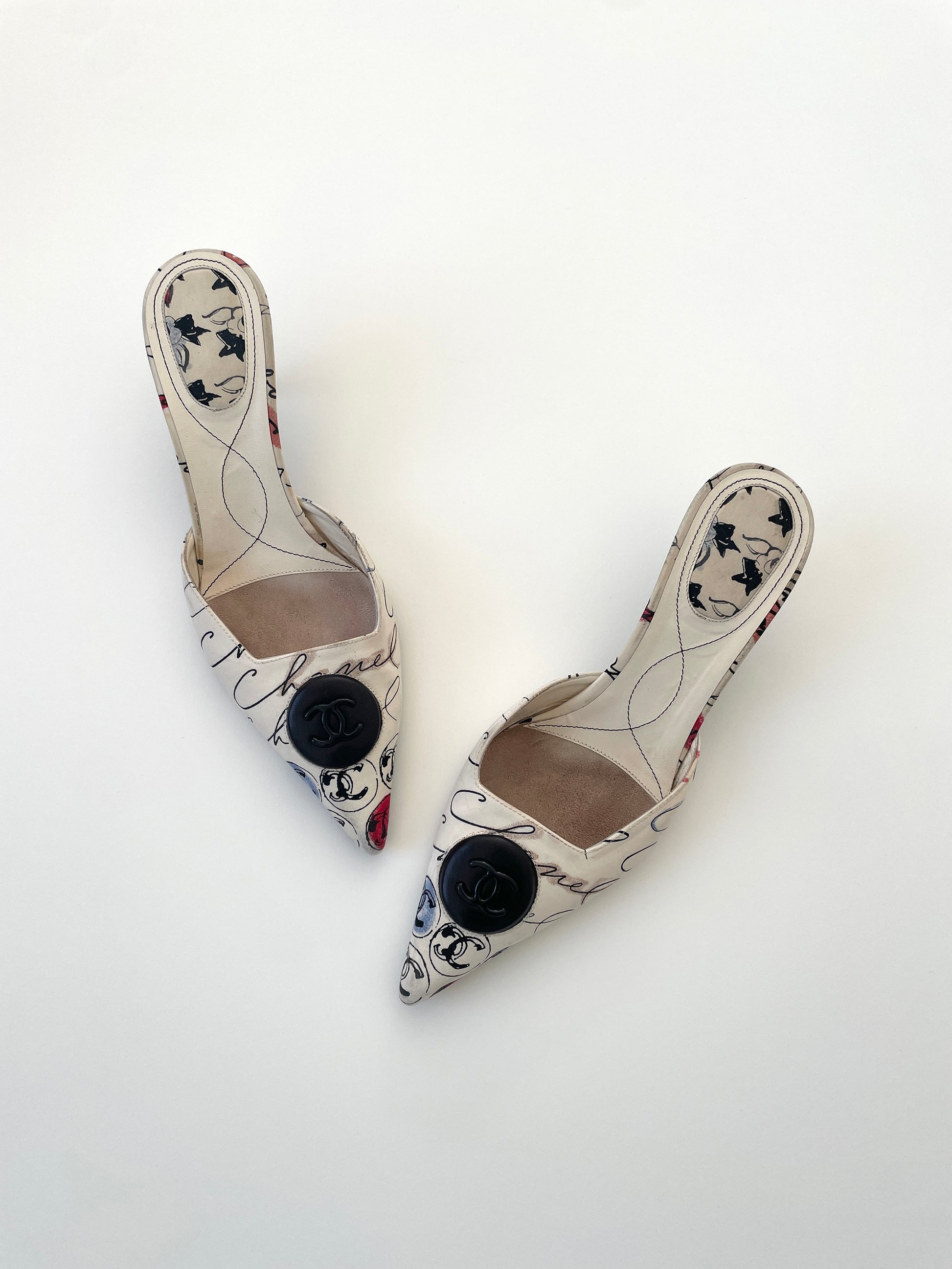 Vintage iconic Chanel 2000 edition cream white cloth mules with illustrations by by Karl Lagerfeld