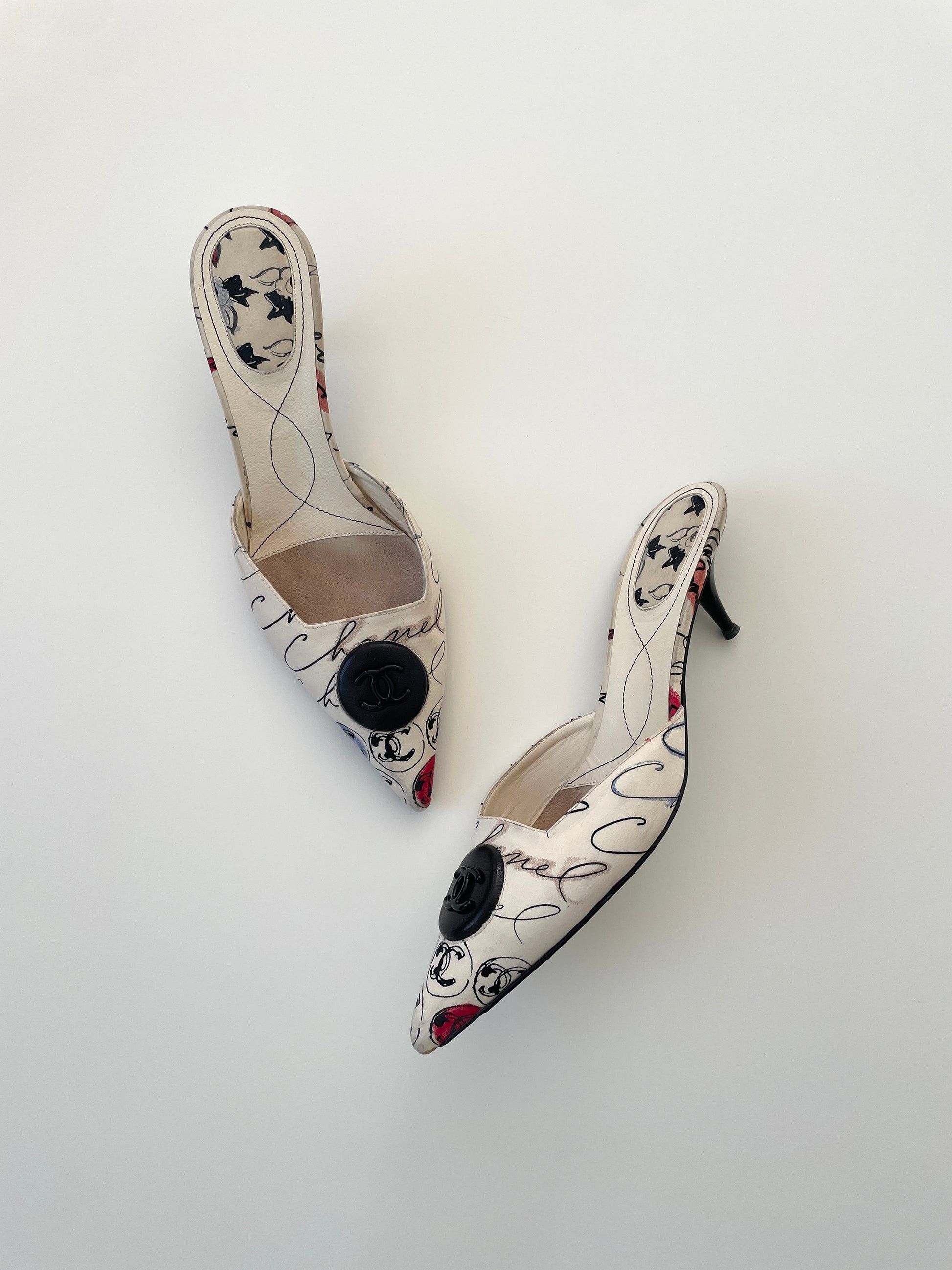 Vintage iconic Chanel 2000 edition cream white cloth mules with illustrations by by Karl Lagerfeld