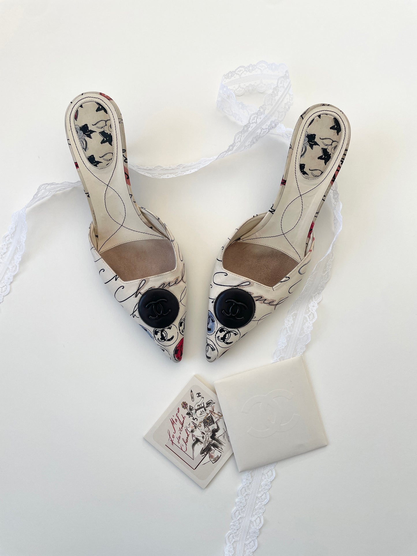 Vintage iconic Chanel 2000 edition cream white cloth mules with illustrations by by Karl Lagerfeld