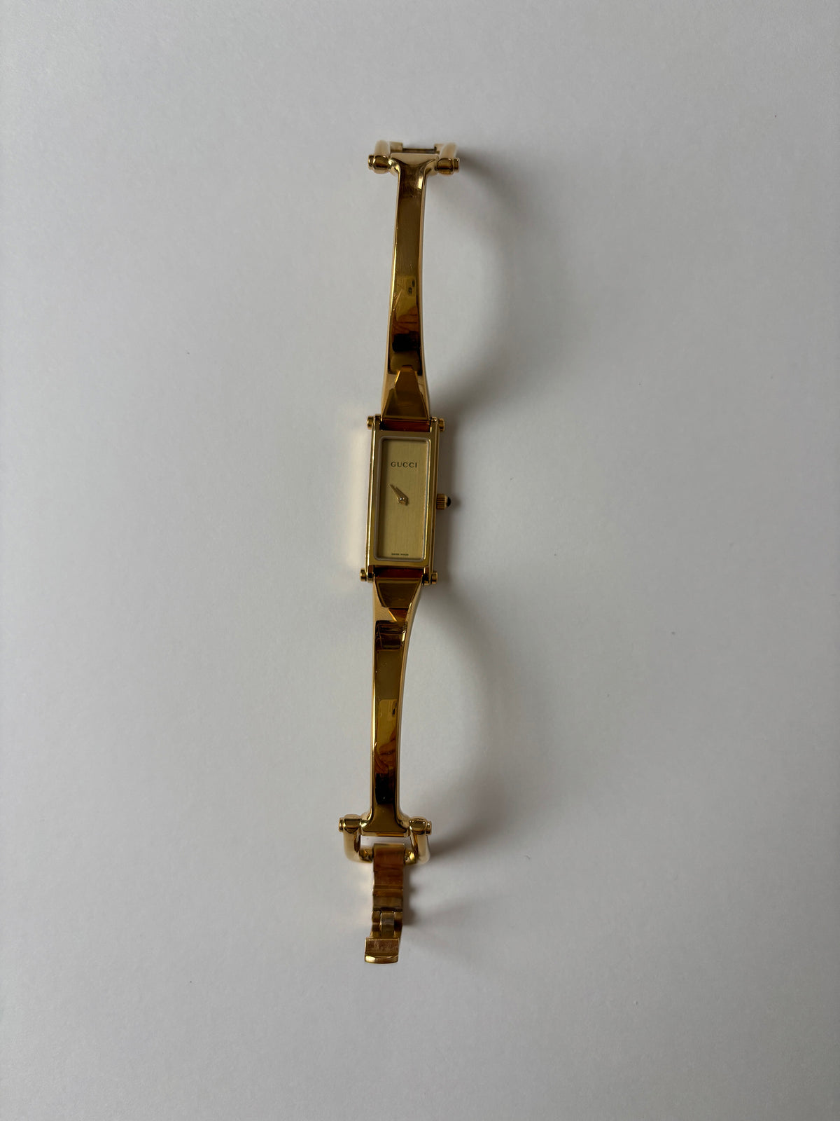 Gucci by Tom Ford 1990s 1500L 18K gold plated bangle watch