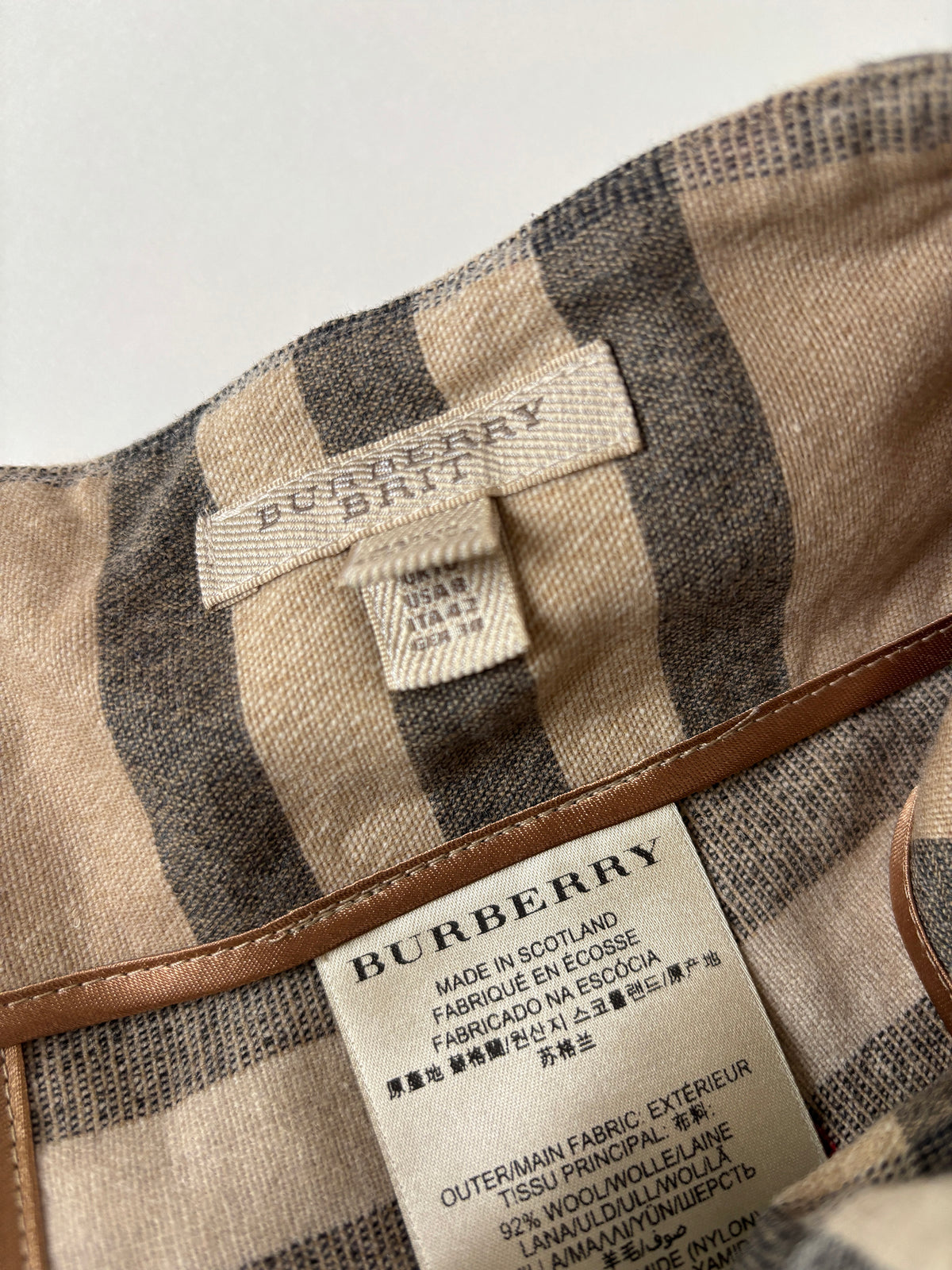 Burberry Brit 2000s beige tartan wool mini skirt with leather straps  S-M