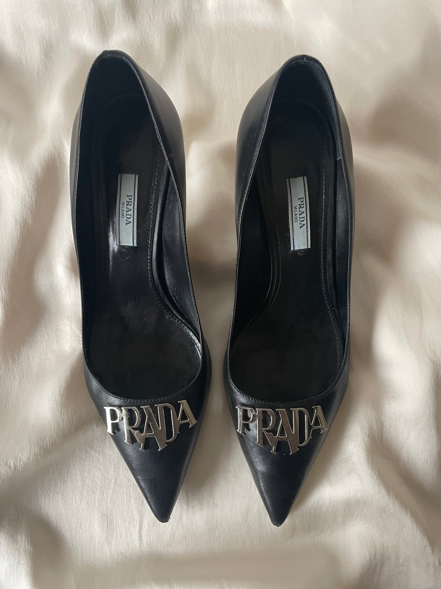 Prada metal logo pointed heels