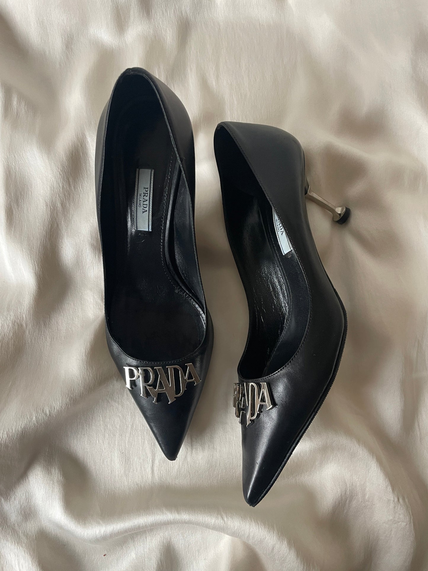 Prada metal logo pointed heels