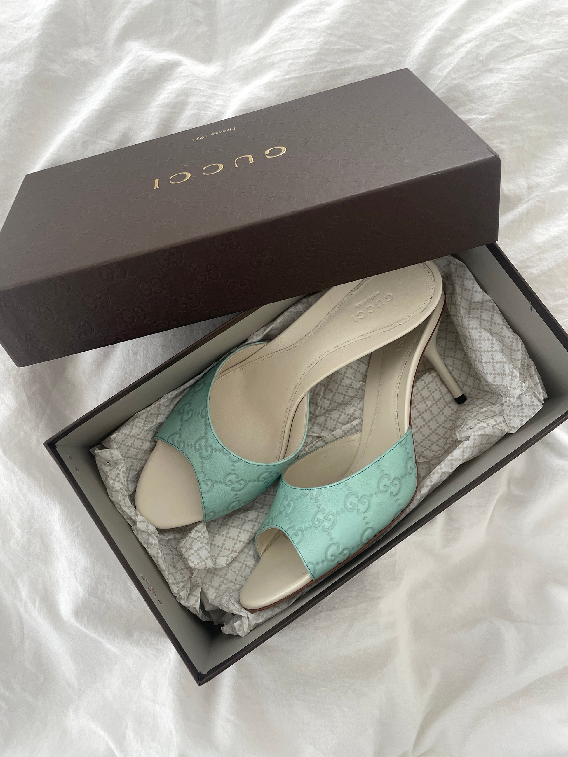 Vintage Gucci 2000s sea blue and cream embossed monogram sandals. Very rare find in UNWORN condition.