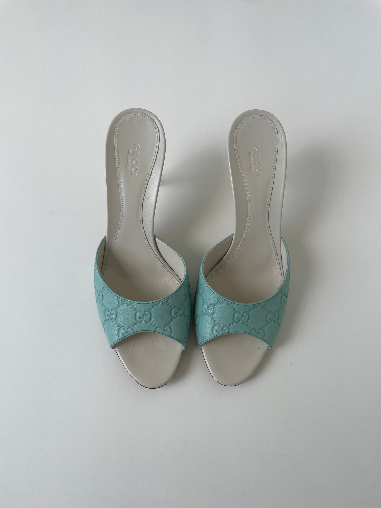 Vintage Gucci 2000s sea blue and cream embossed monogram sandals. Very rare find in UNWORN condition.