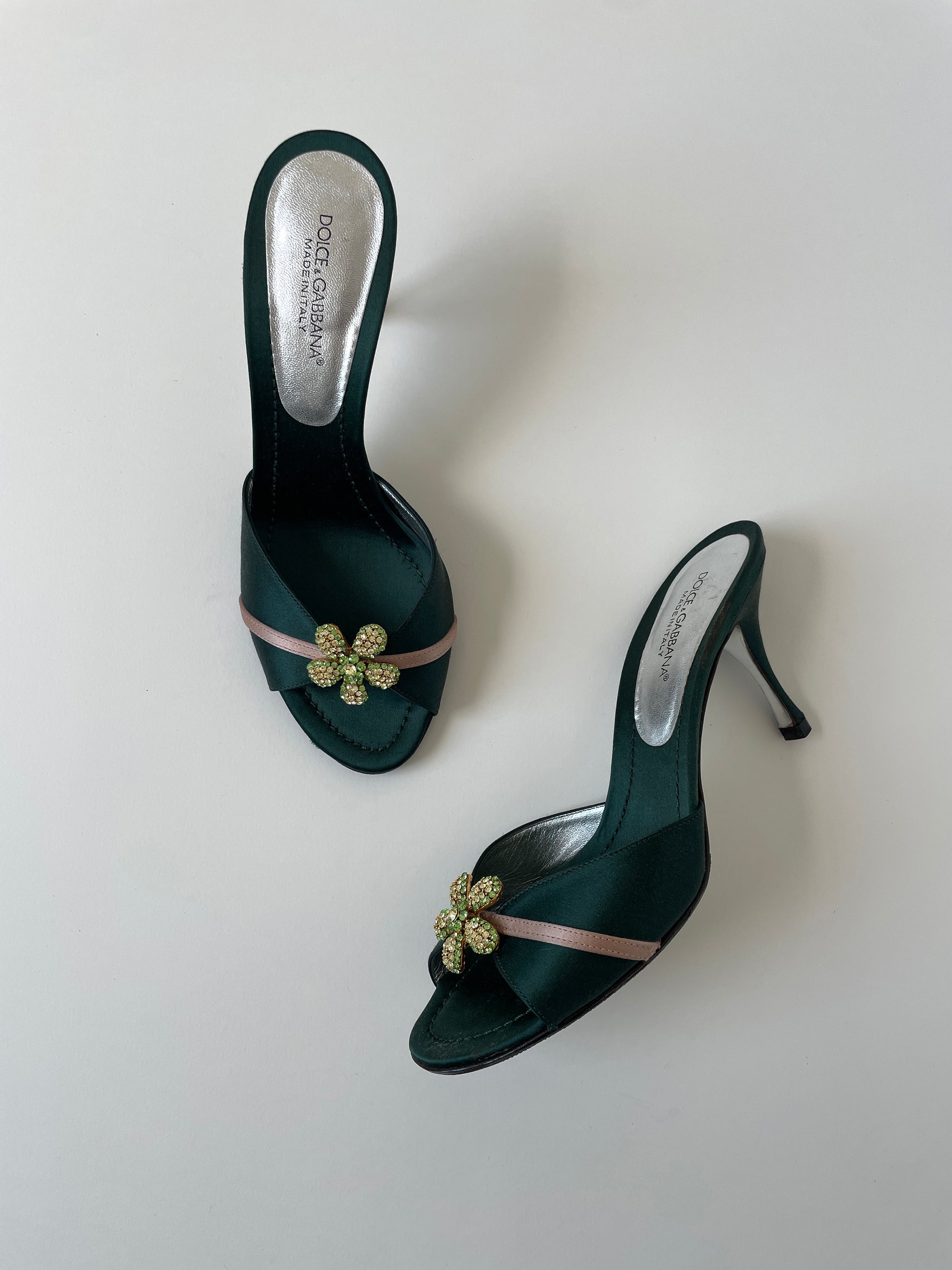 Vintage Dolce &amp; Gabbana 2000s emerald satin heels with green rhinestone flower application.