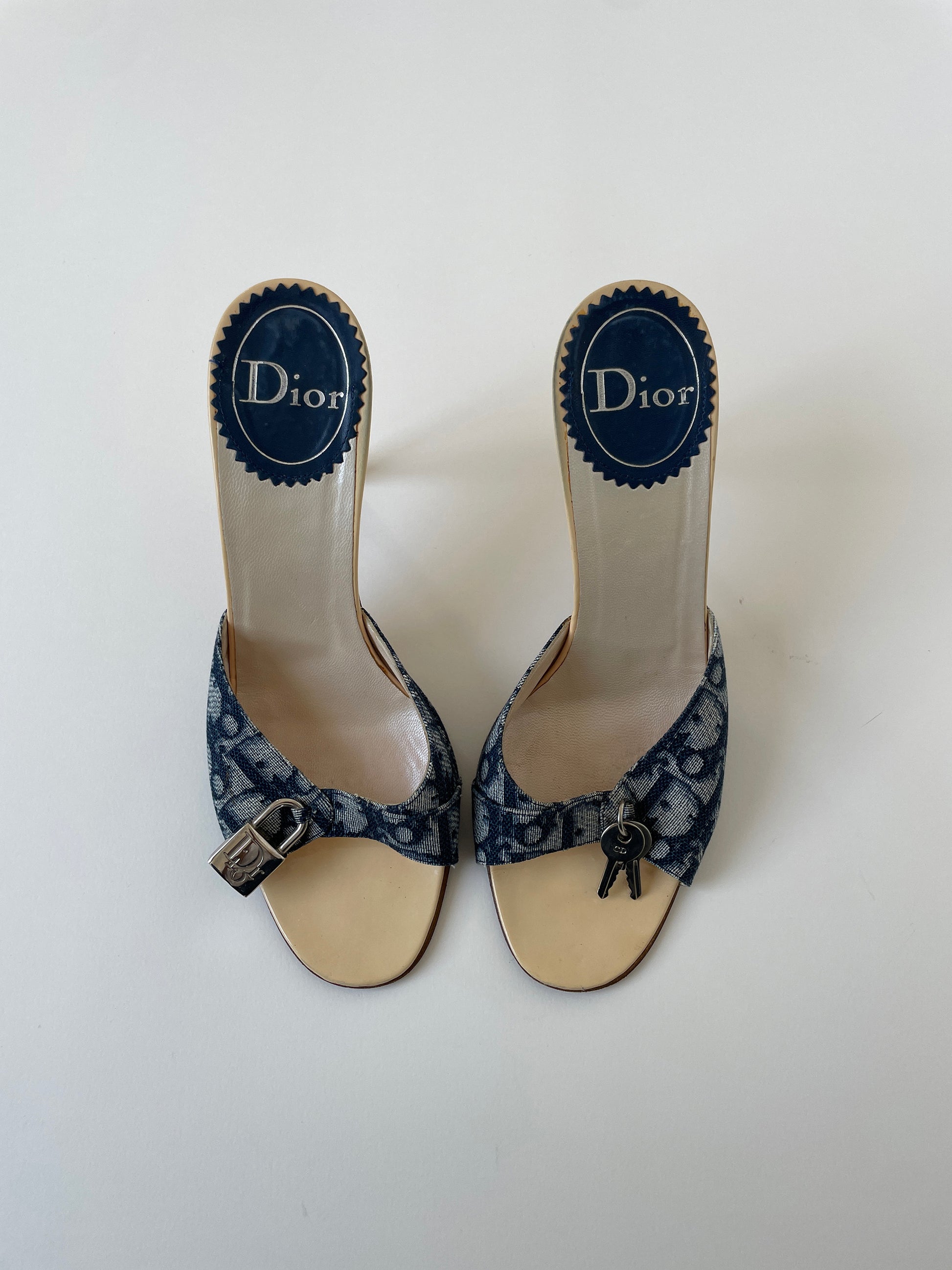 Vintage Christian Dior 2000s iconic denim blue monogram lock key heels with silver padlock details.