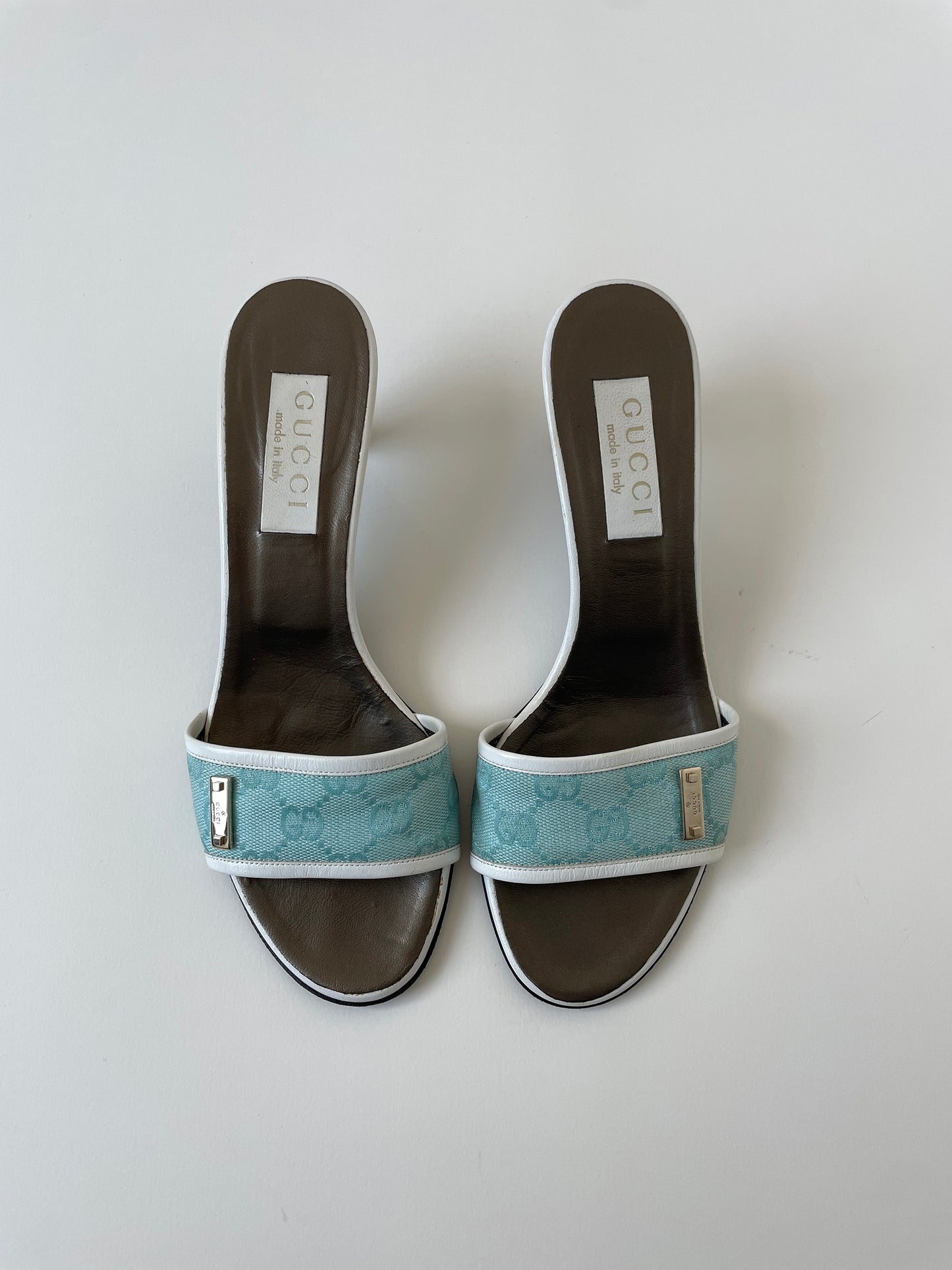 Vintage Gucci 2000s by Tom Ford light blue monogram heels with silver details.
