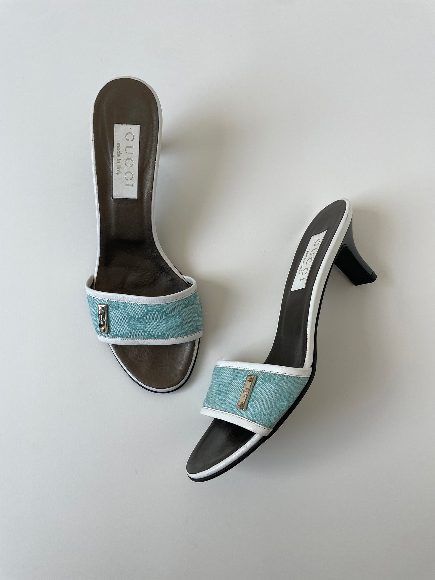 Vintage Gucci 2000s by Tom Ford light blue monogram heels with silver details.