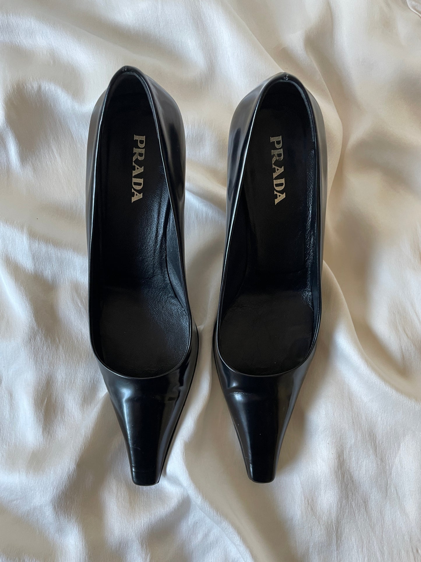 Prada patent leather metal logo heels