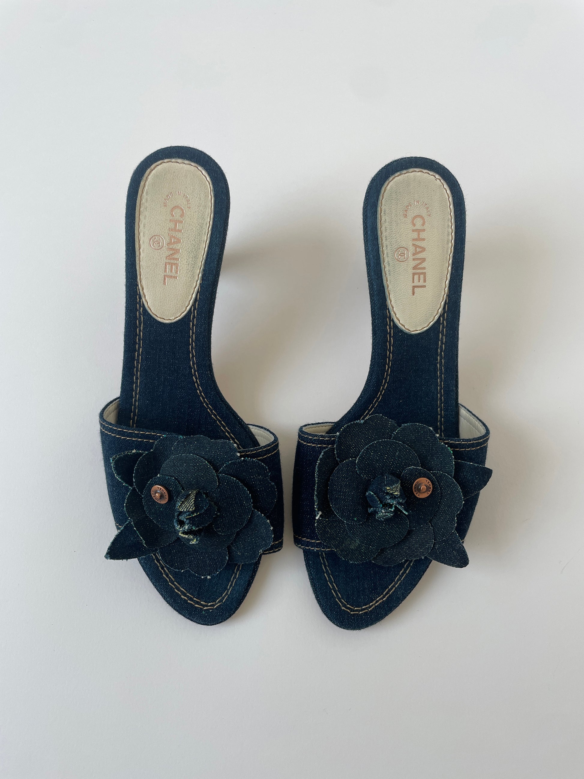 Vintage Chanel 2000s by Karl Lagerfeld iconic denim heels with chunky Camellia flower application.