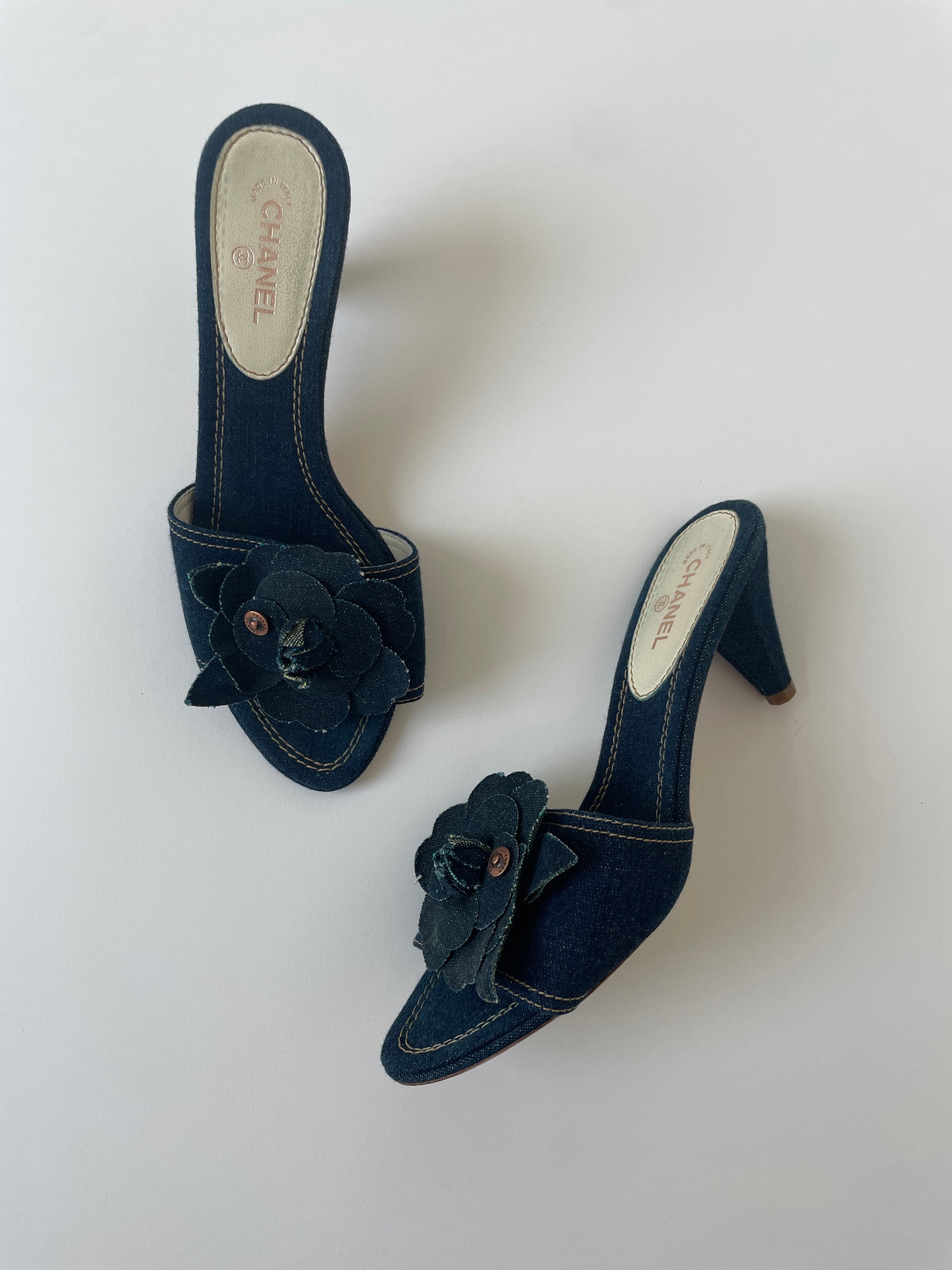 Vintage Chanel 2000s by Karl Lagerfeld iconic denim heels with chunky Camellia flower application.