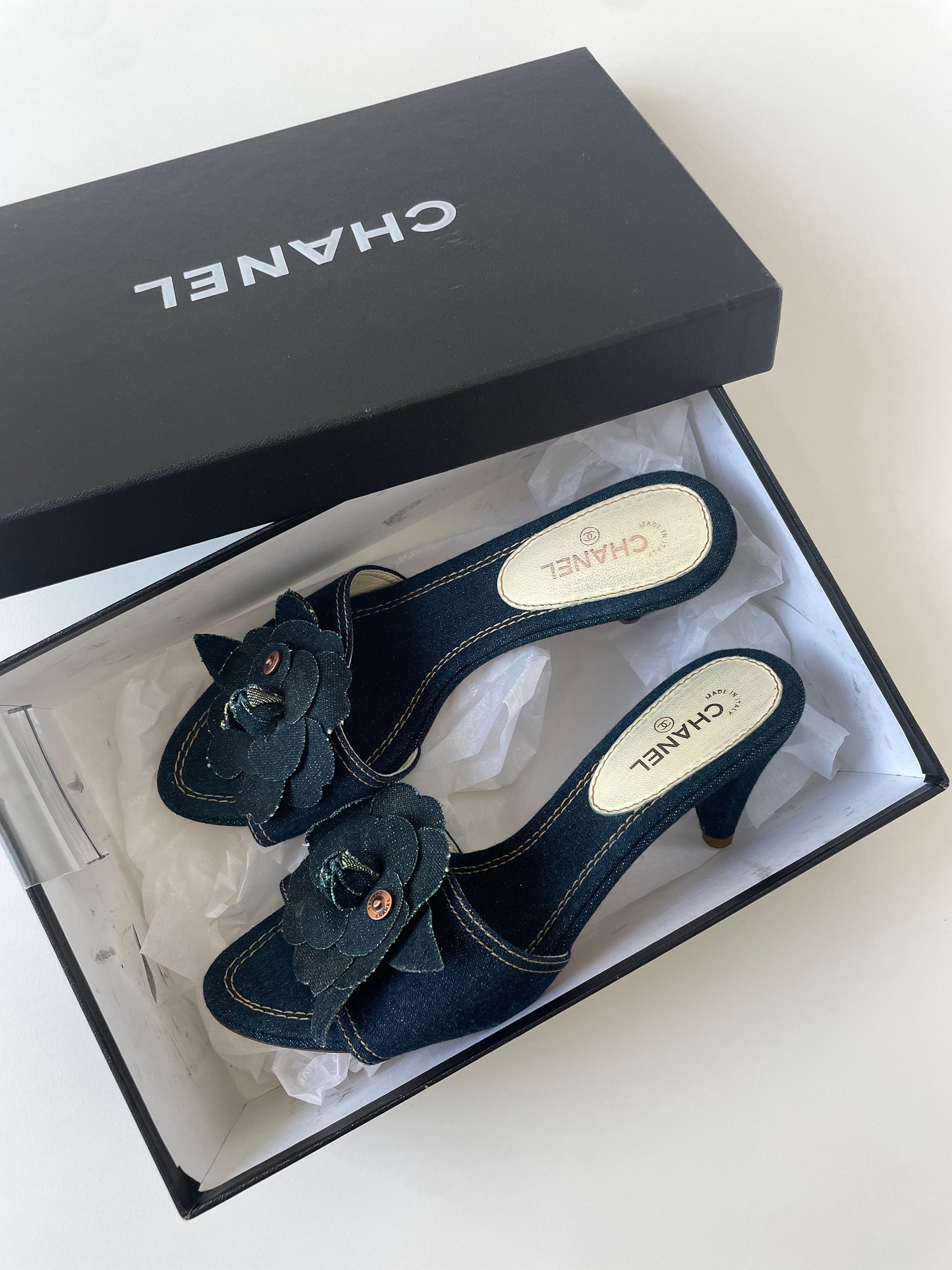 Vintage Chanel 2000s by Karl Lagerfeld iconic denim heels with chunky Camellia flower application.