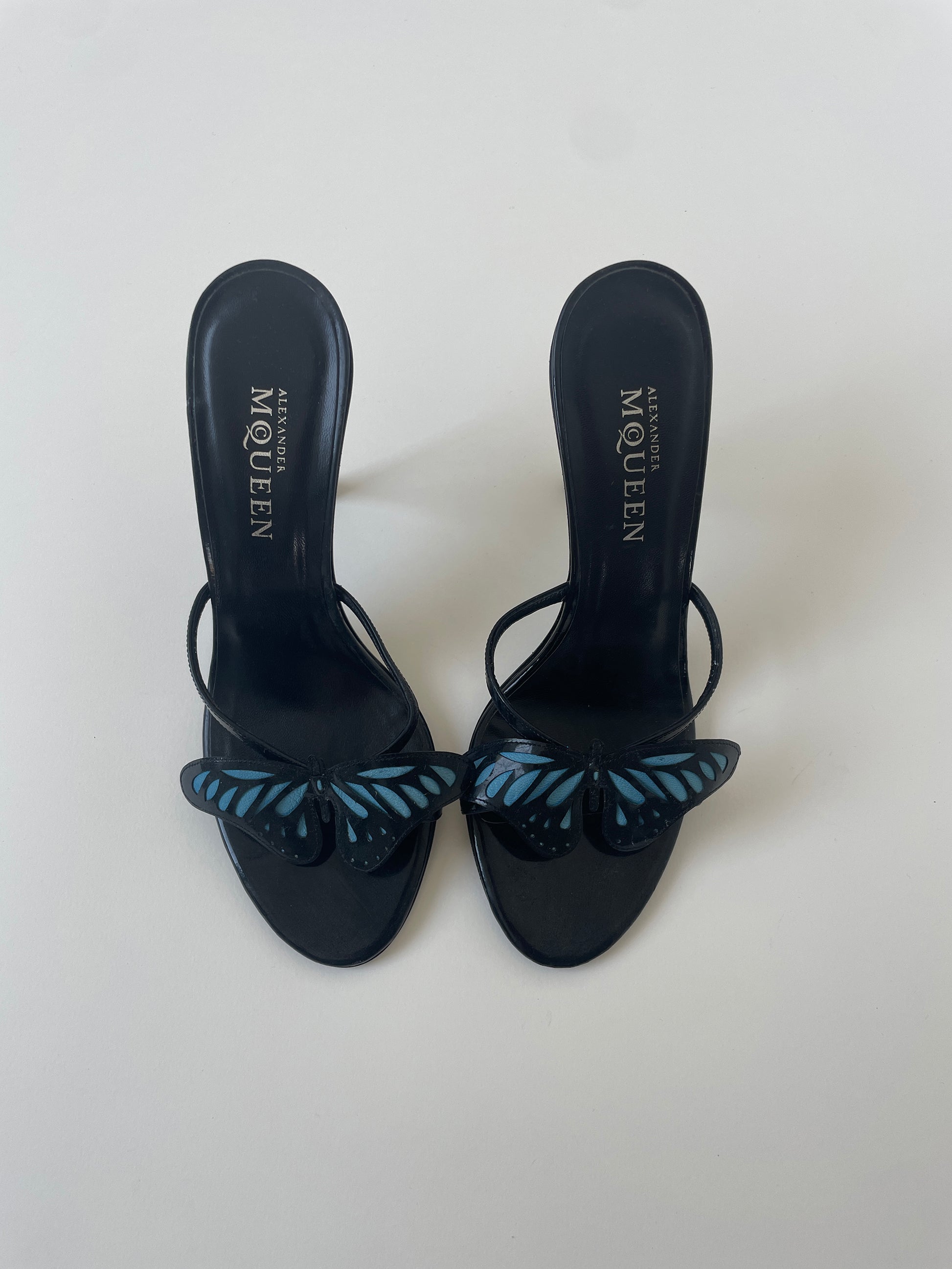 Alexander McQueen 2000s iconic butterfly heels with cute blue butterfly application, patent leather and metal heel.