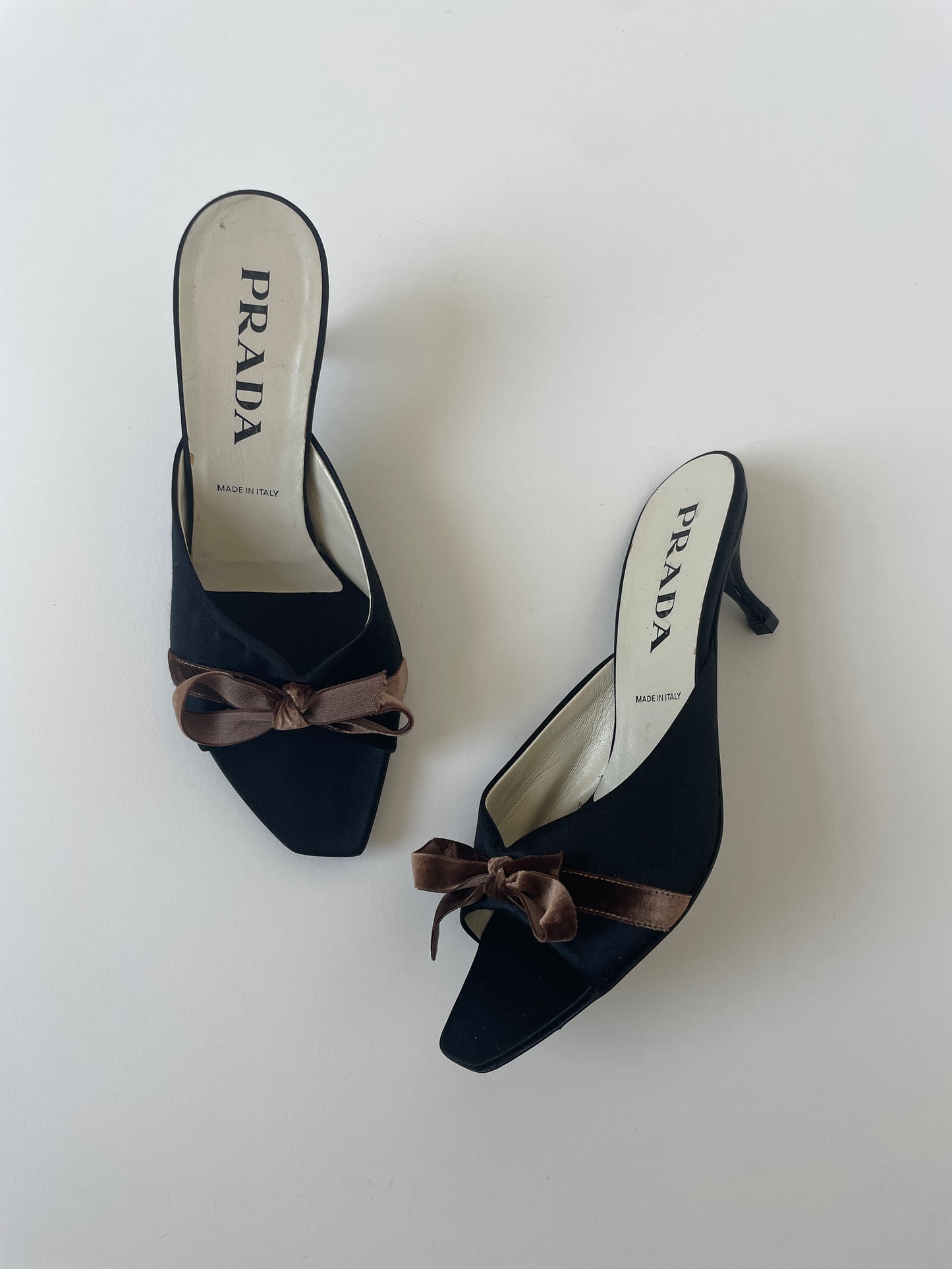Vintage Prada 1990s black silk kitten heels with cute brown bow details.