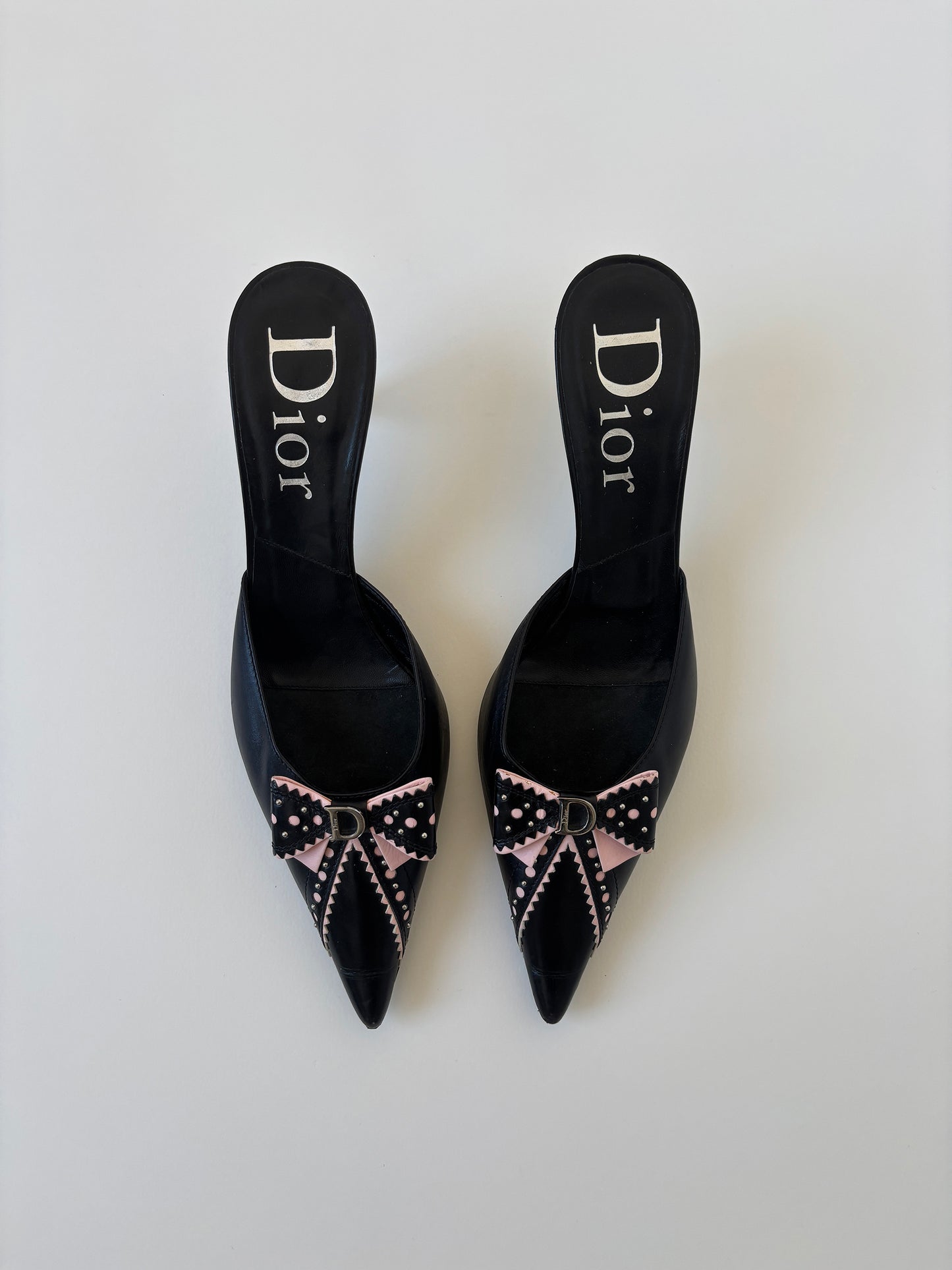 Vintage Christian Dior by John Galliano 2000s black pink D Trick bow kitten heels with cute mini logo and dainty eyelets.
