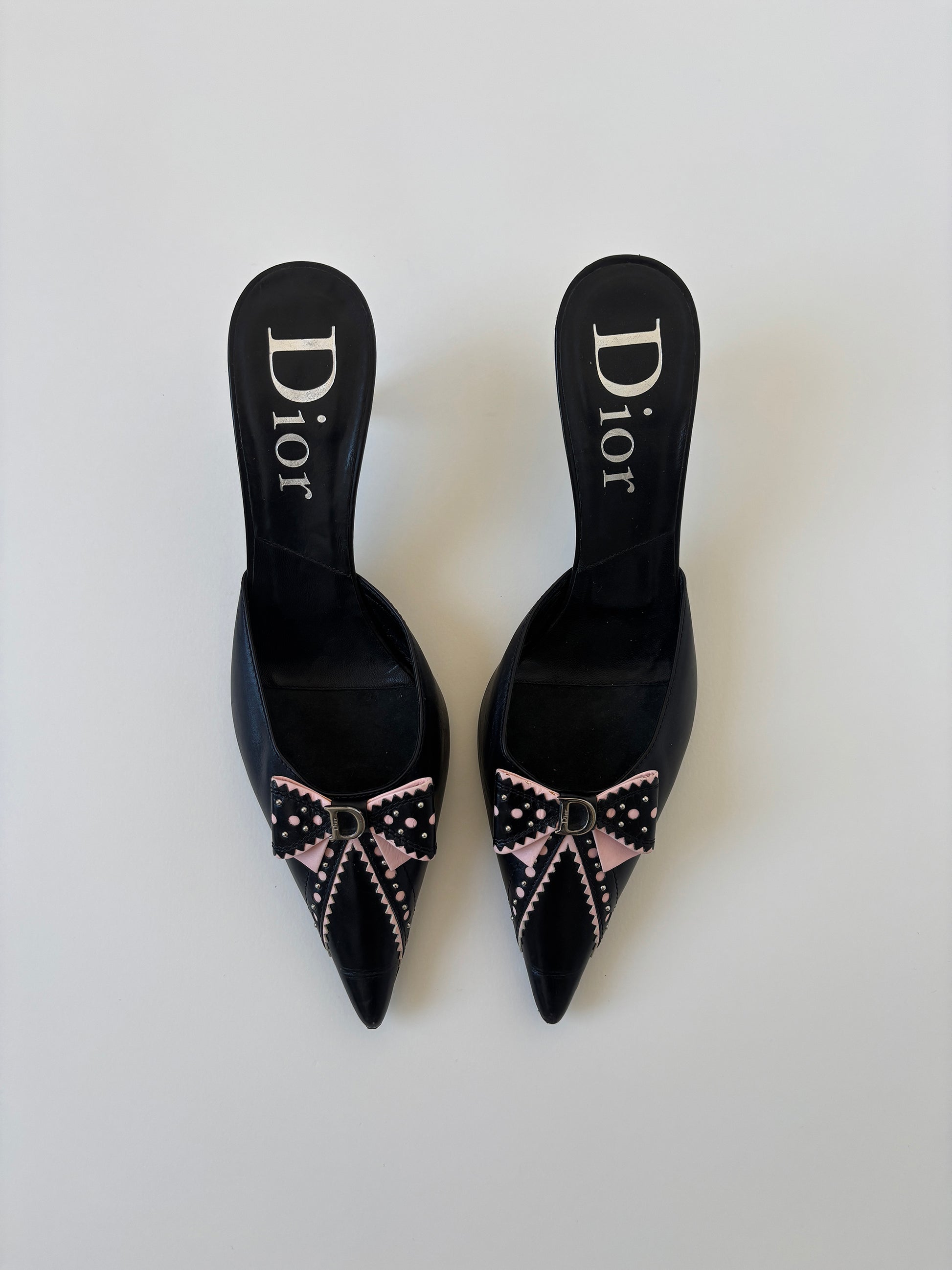 Vintage Christian Dior by John Galliano 2000s black pink D Trick bow kitten heels with cute mini logo and dainty eyelets.
