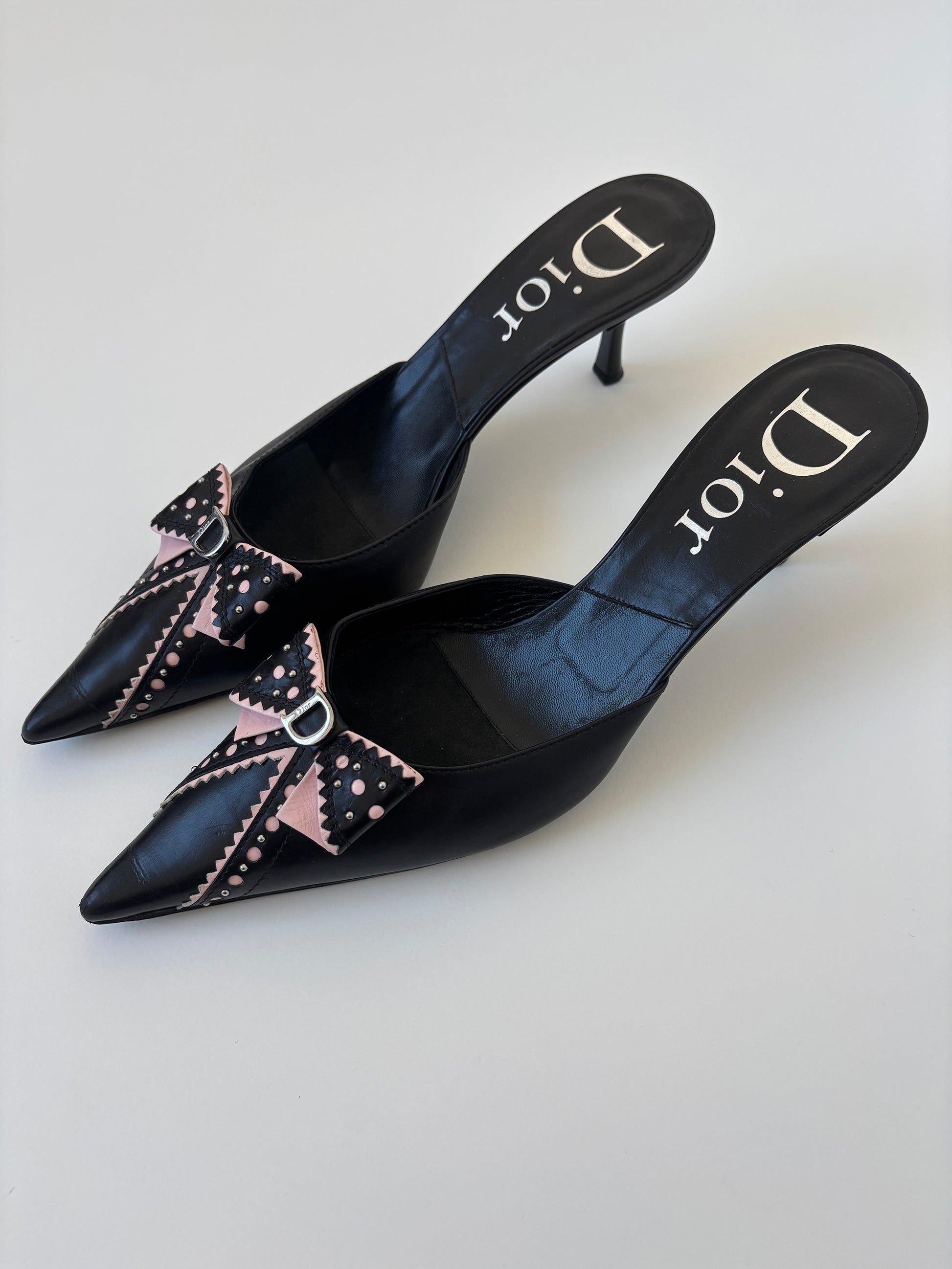 Vintage Christian Dior by John Galliano 2000s black pink D Trick bow kitten heels with cute mini logo and dainty eyelets.
