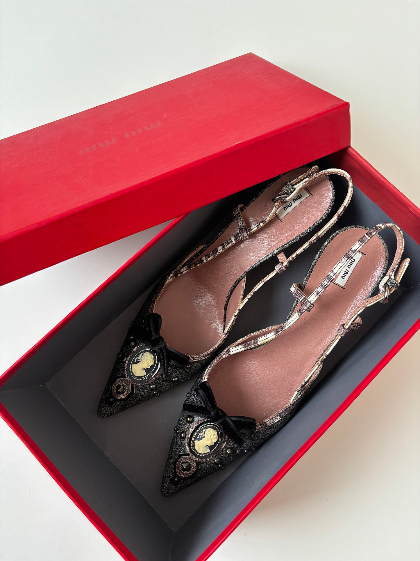 Vintage Miu Miu 2000s sling back kitten heels with shell gem and studs details. Very rare model.