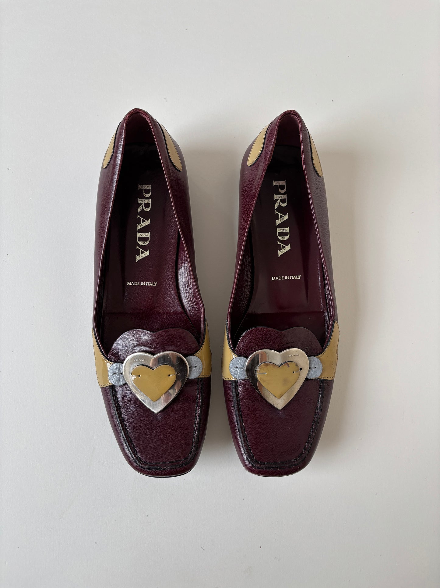 Vintage Prada 2000s burgundy loafer with cute metal heart application