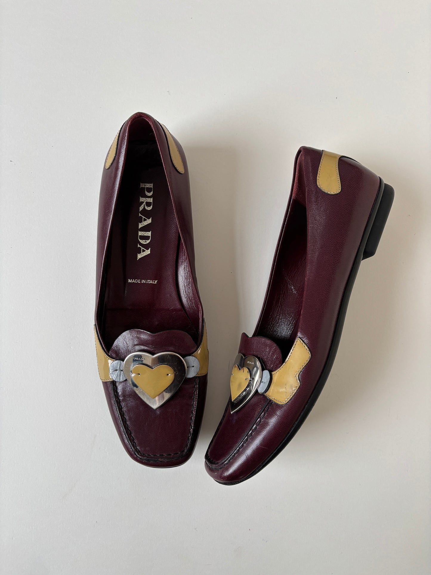 Vintage Prada 2000s burgundy loafer with cute metal heart application