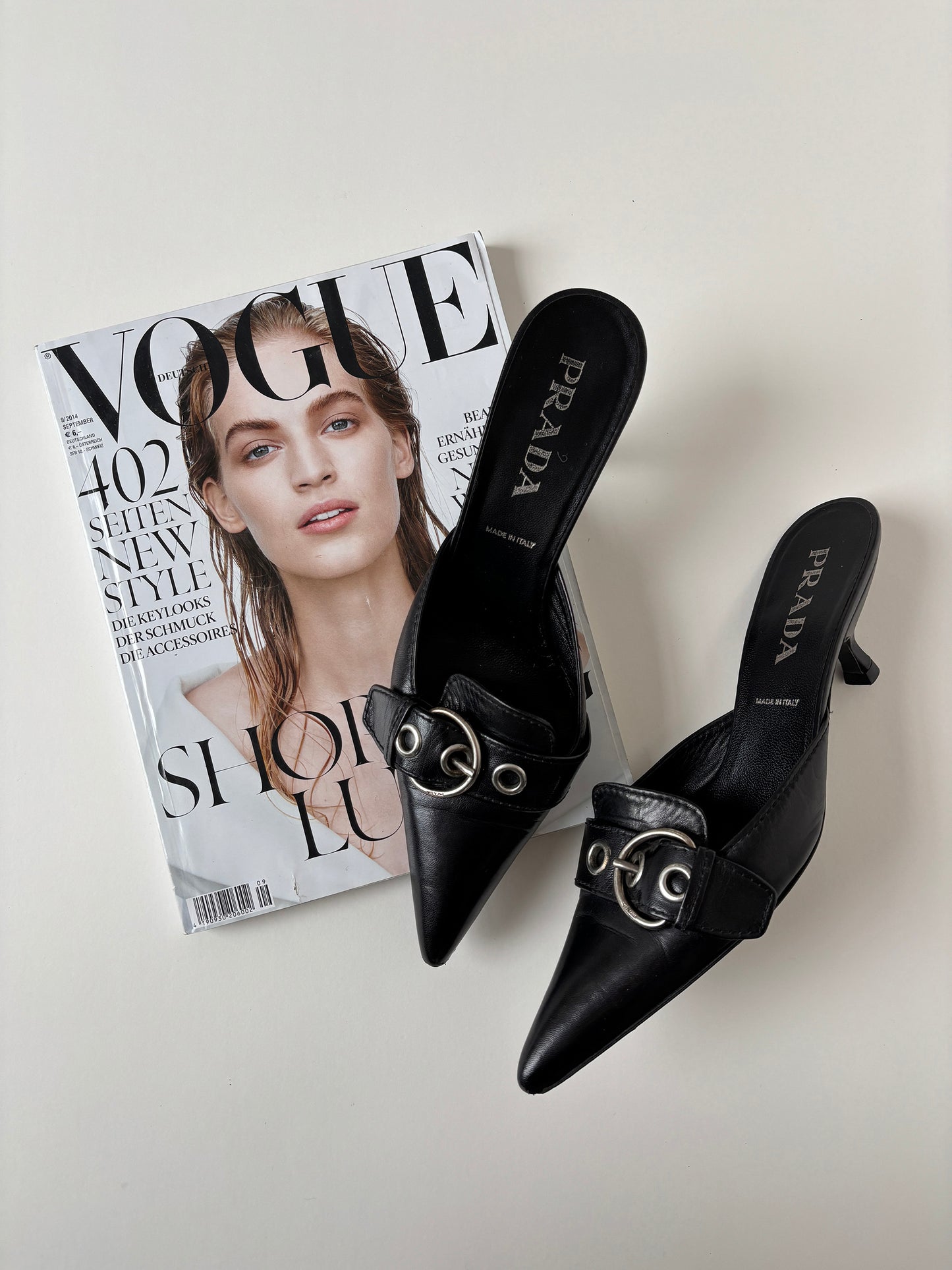 Vintage Prada S/S 2002 black kitten heel mules with silver buckle details.&nbsp;
