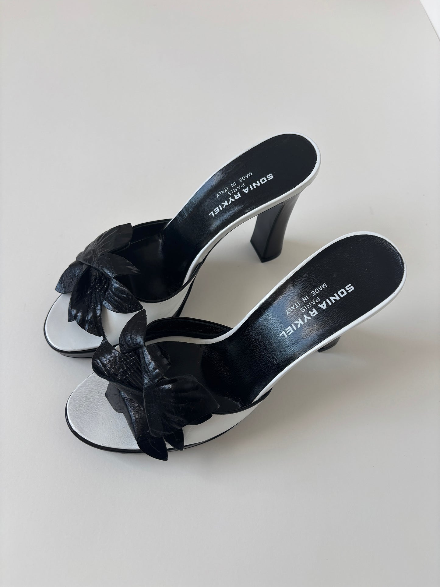 Vintage Sonia Rykiel 2000s black and white floral platform mules with chunky flower application.