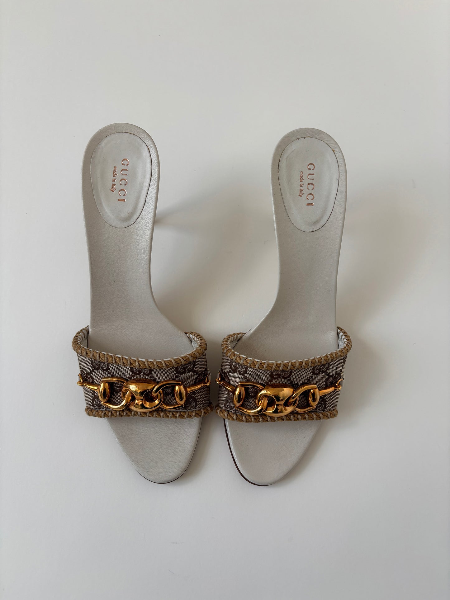 Vintage 2000s Gucci by Tom Ford beige monogram sandals with golden chain details.