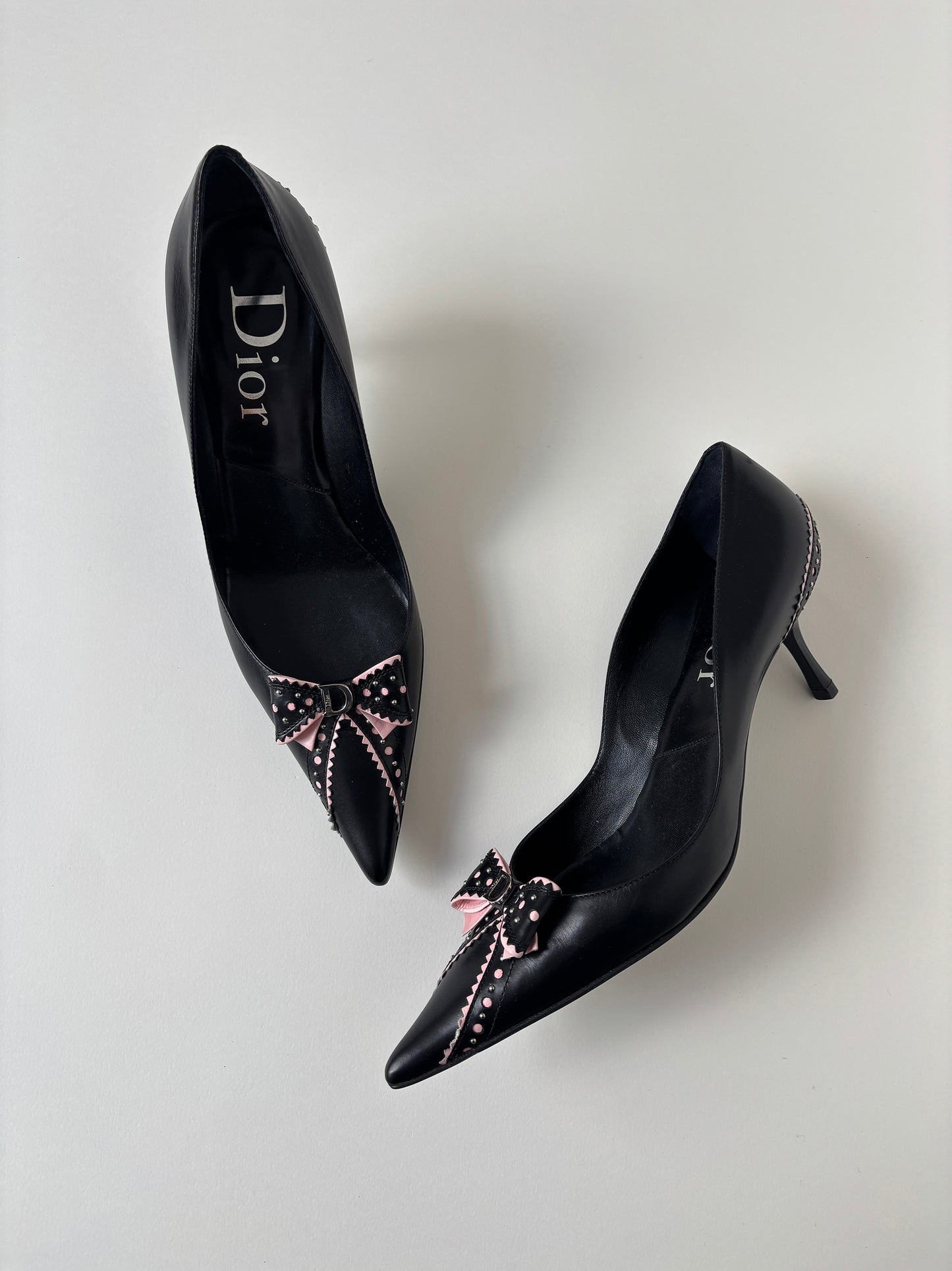 Vintage Christian Dior by John Galliano 2000s black pink D Trick bow kitten heels with cute mini logo and dainty eyelets.