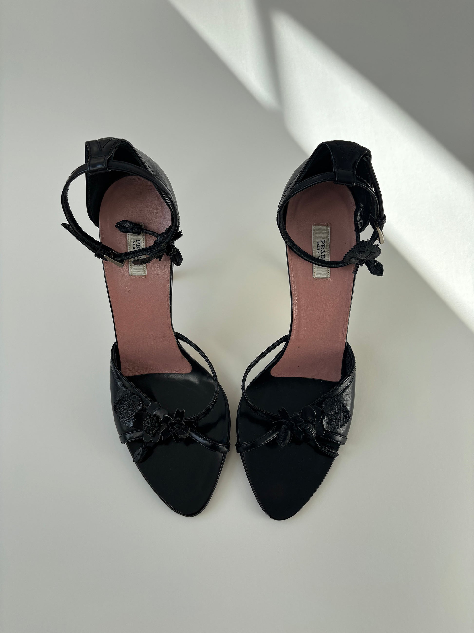Vintage Prada black heels with cute floral details and ankle strap.