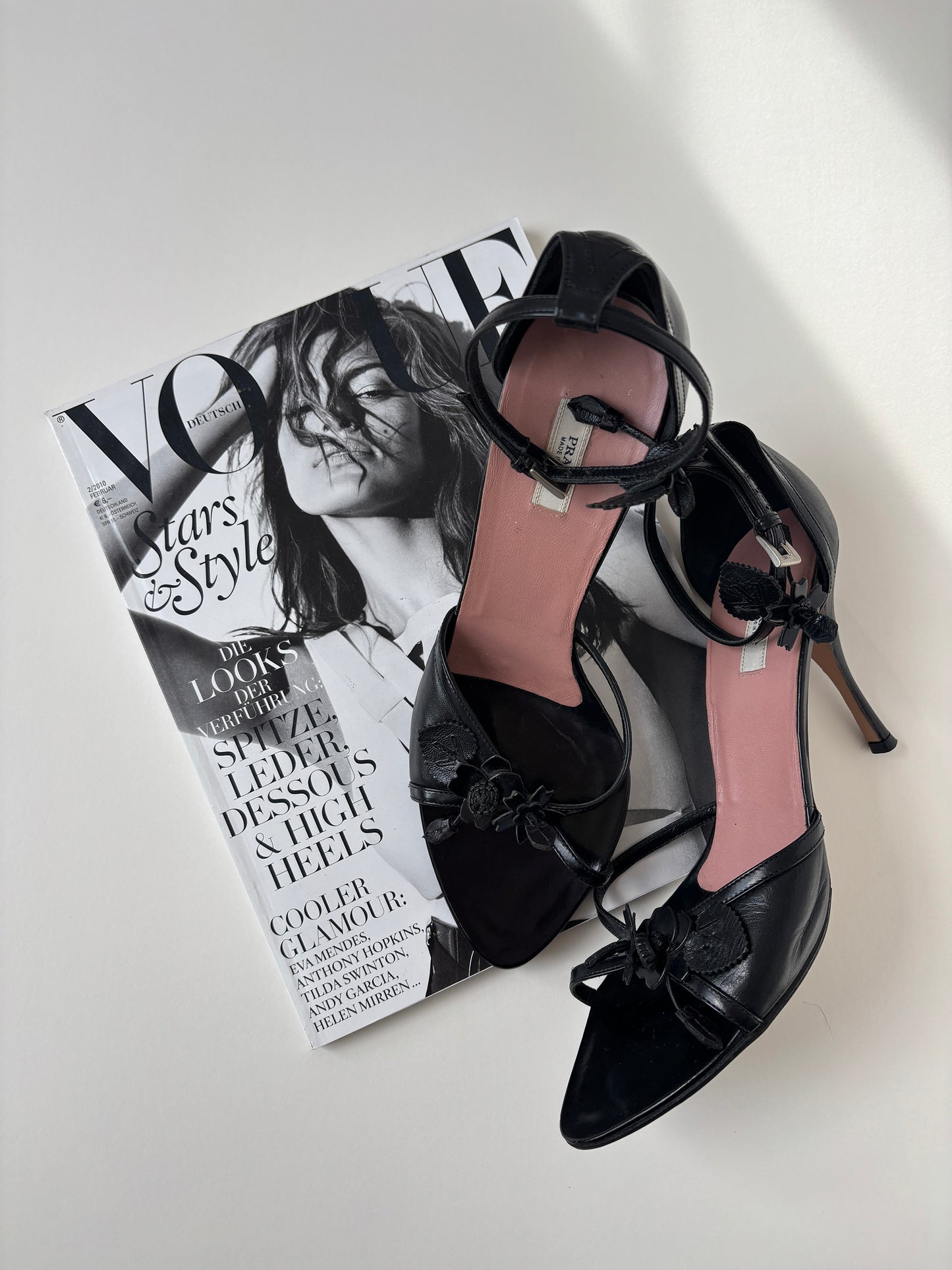 Vintage Prada black heels with cute floral details and ankle strap.