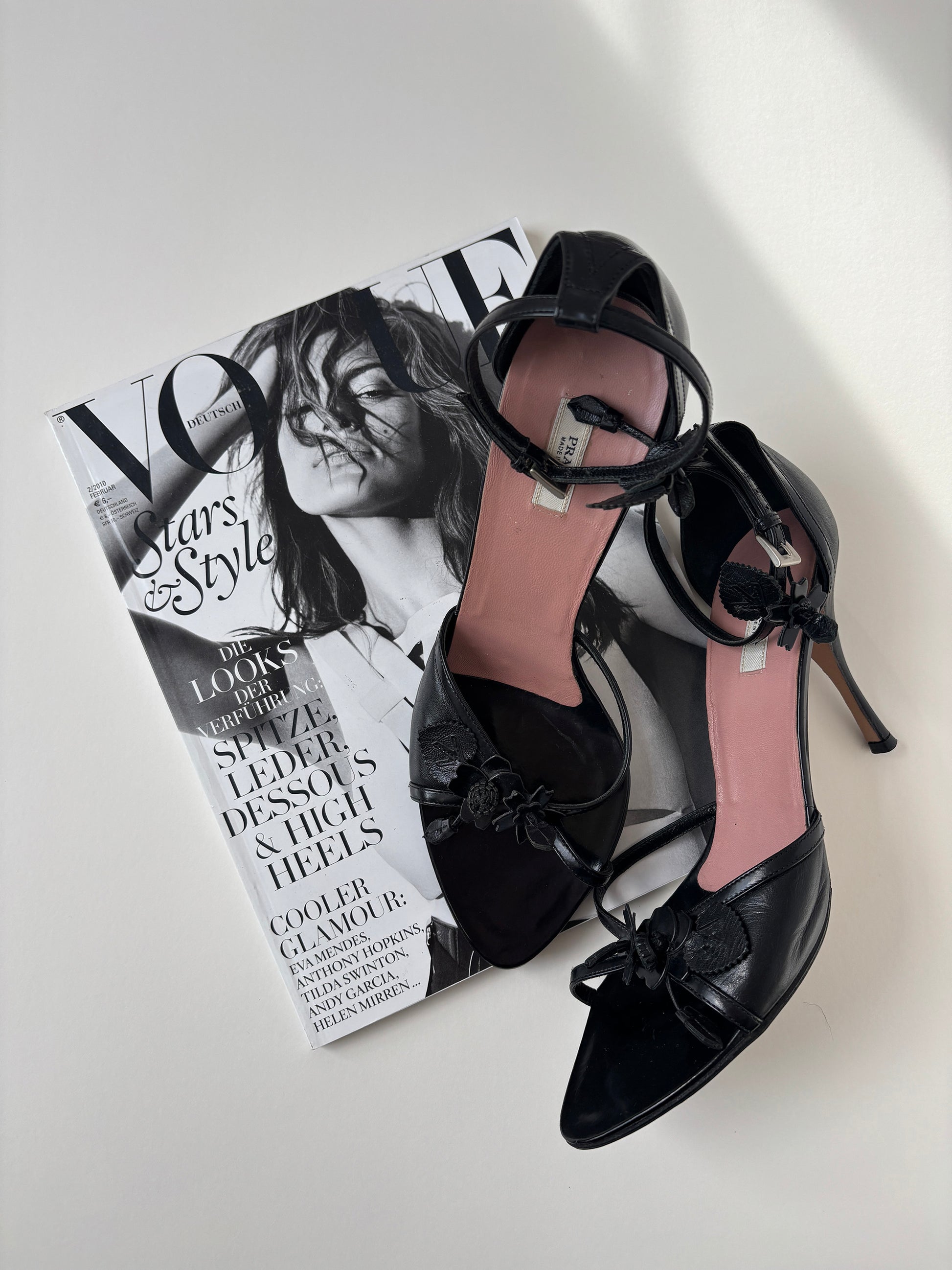 Vintage Prada black heels with cute floral details and ankle strap.