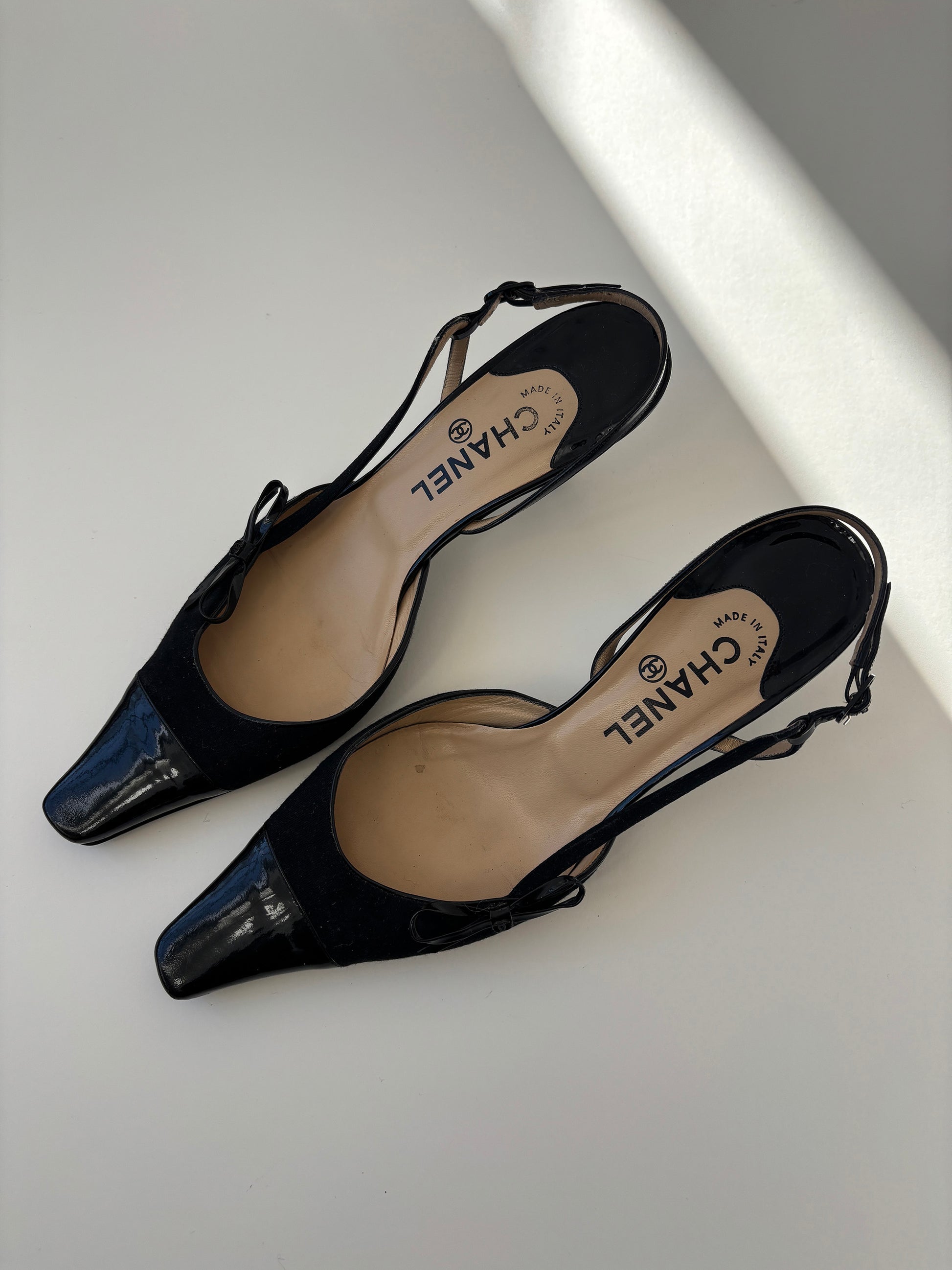 Vintage Chanel by Karl Lagerfeld 2000s black sling back kitten heels with bow details.