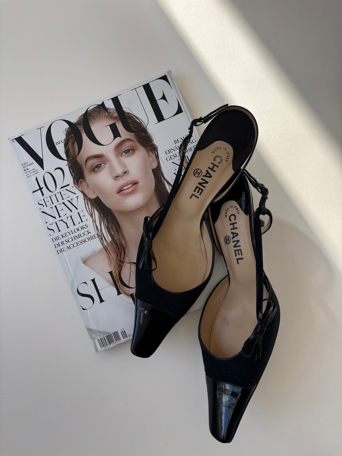 Vintage Chanel by Karl Lagerfeld 2000s black sling back kitten heels with bow details.