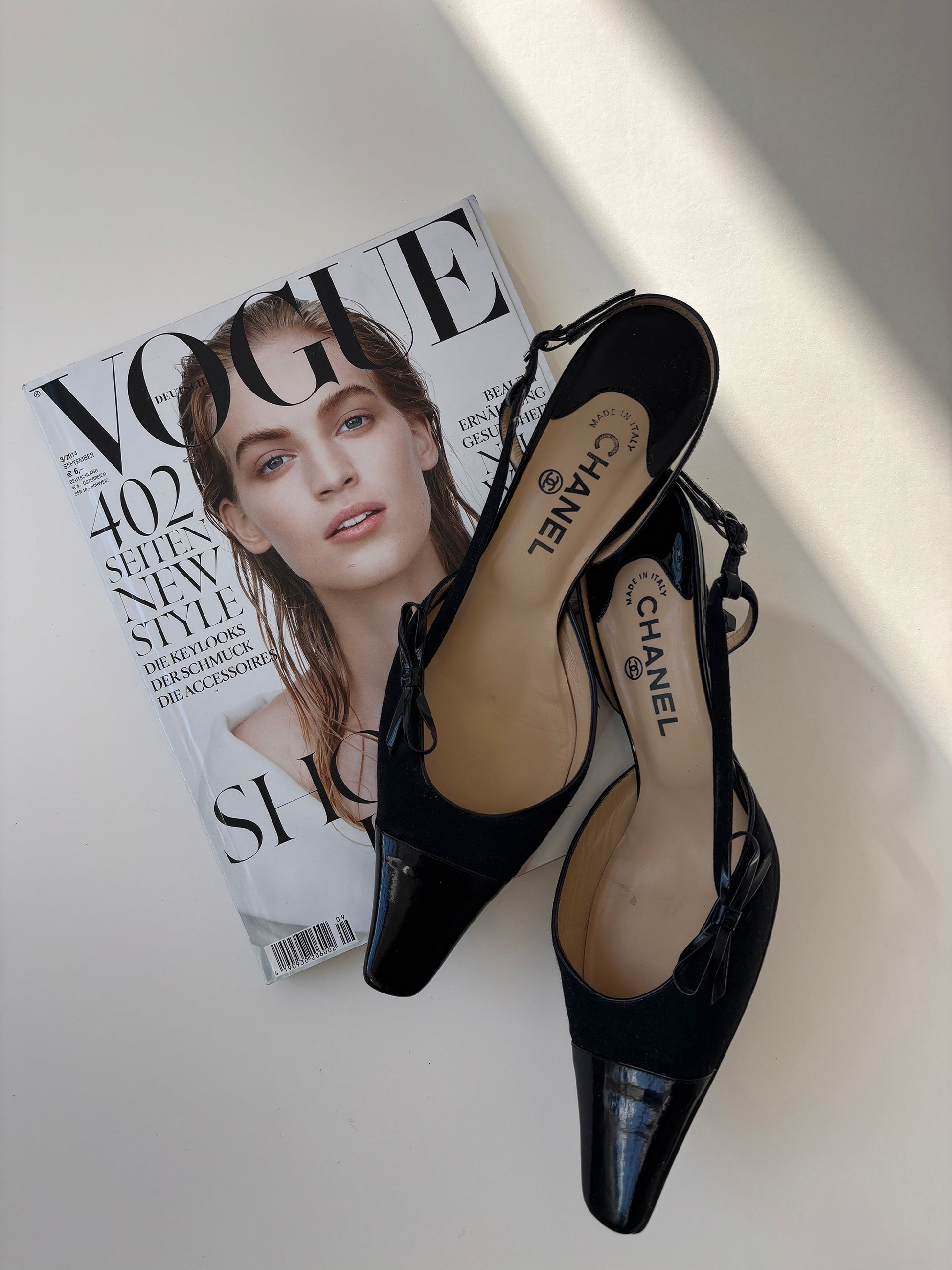 Vintage Chanel by Karl Lagerfeld 2000s black sling back kitten heels with bow details.