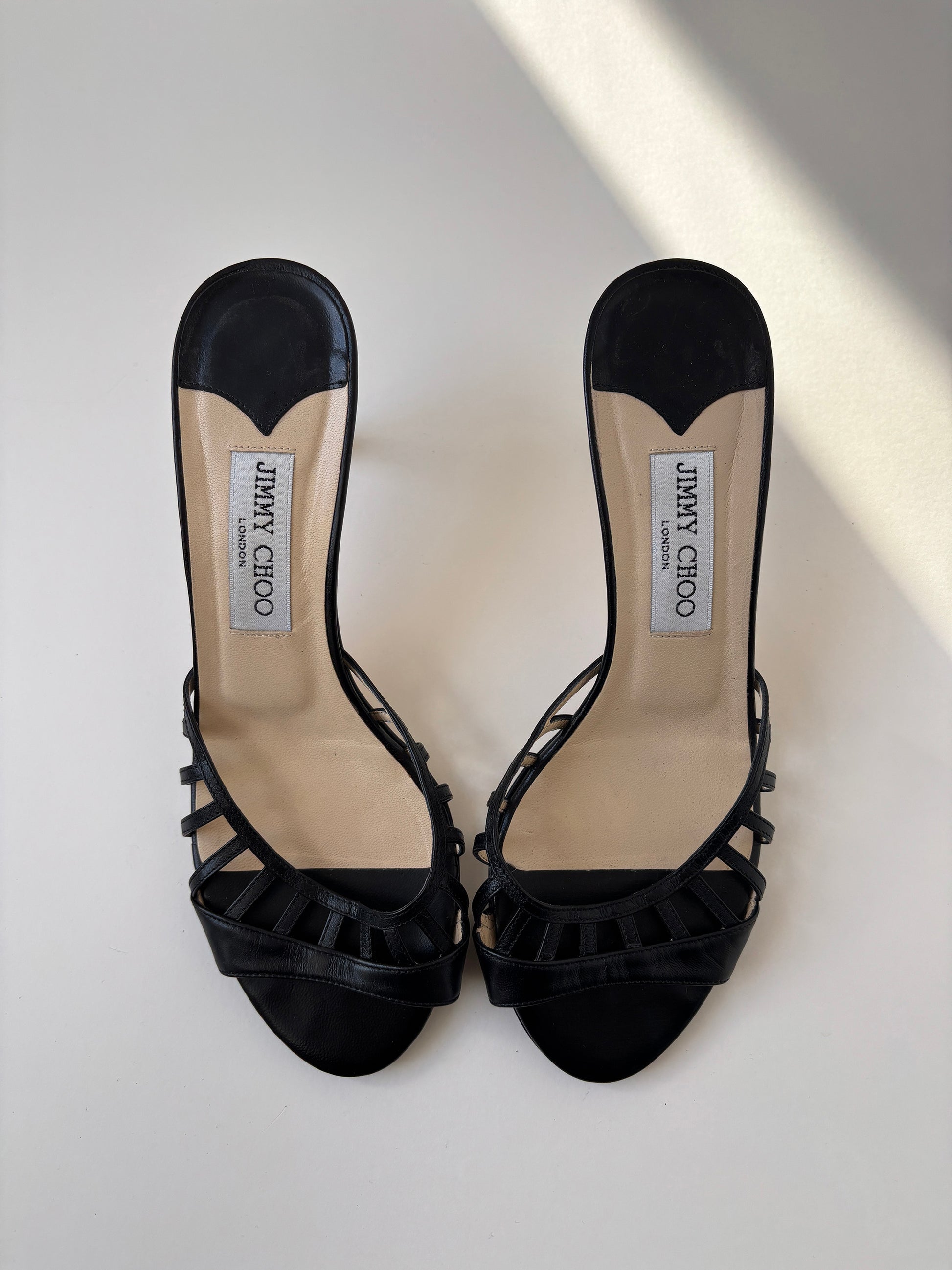 Vintage Jimmy Choo 2000s black kitten heels with cute cutouts.