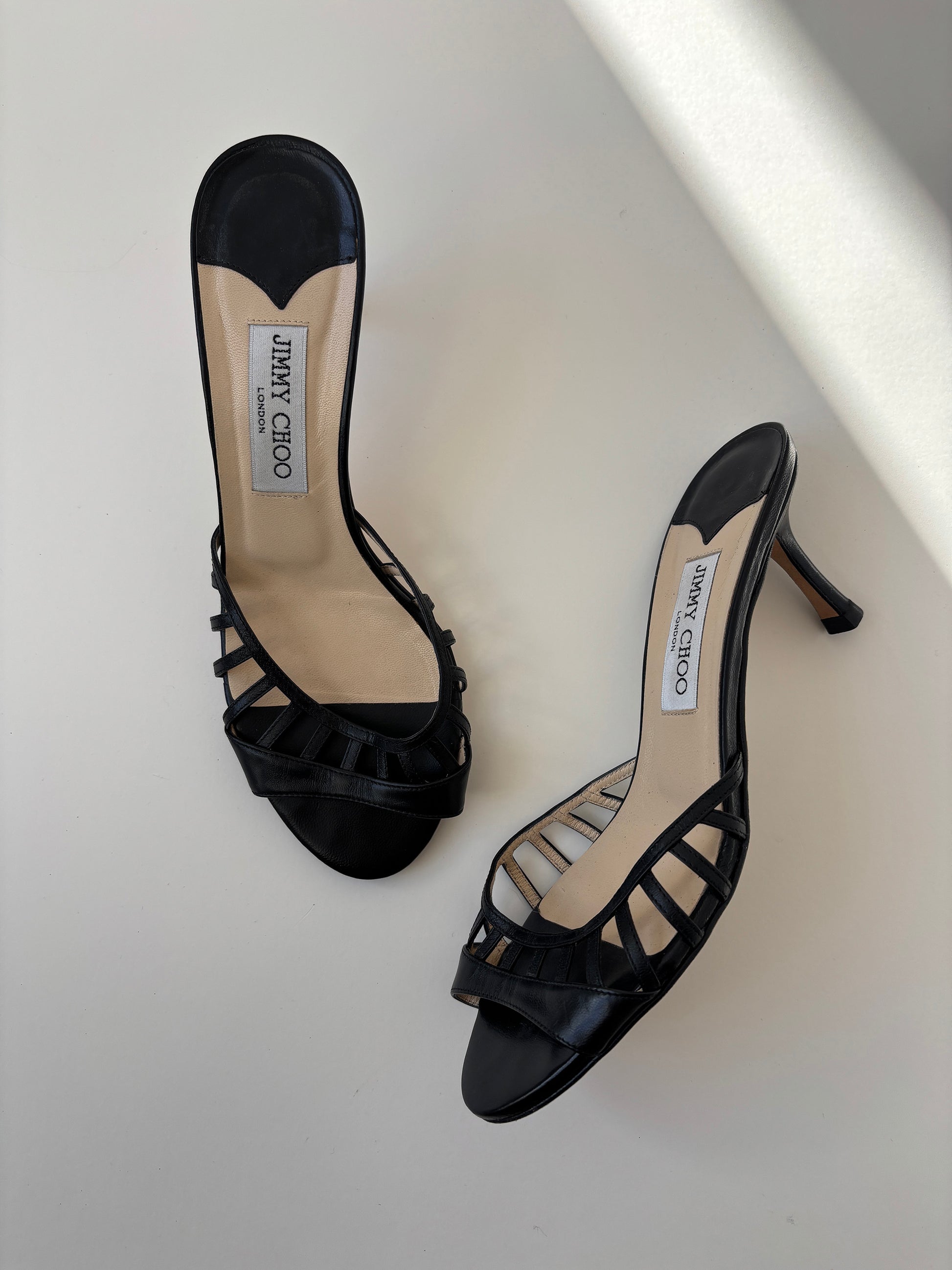Vintage Jimmy Choo 2000s black kitten heels with cute cutouts.