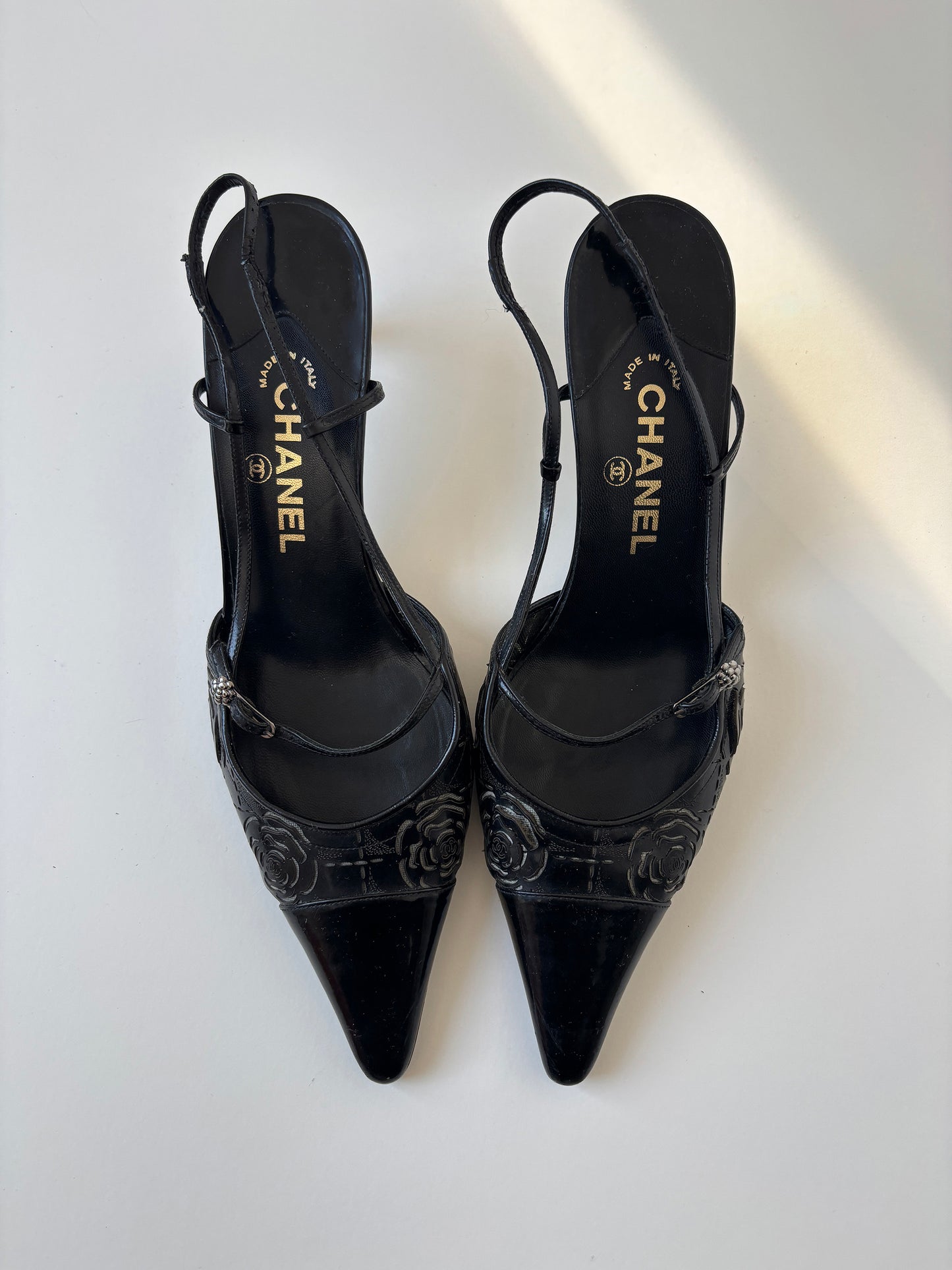 Vintage Chanel by Karl Lagerfeld 2000s black sling back kitten heels with roses cutouts.